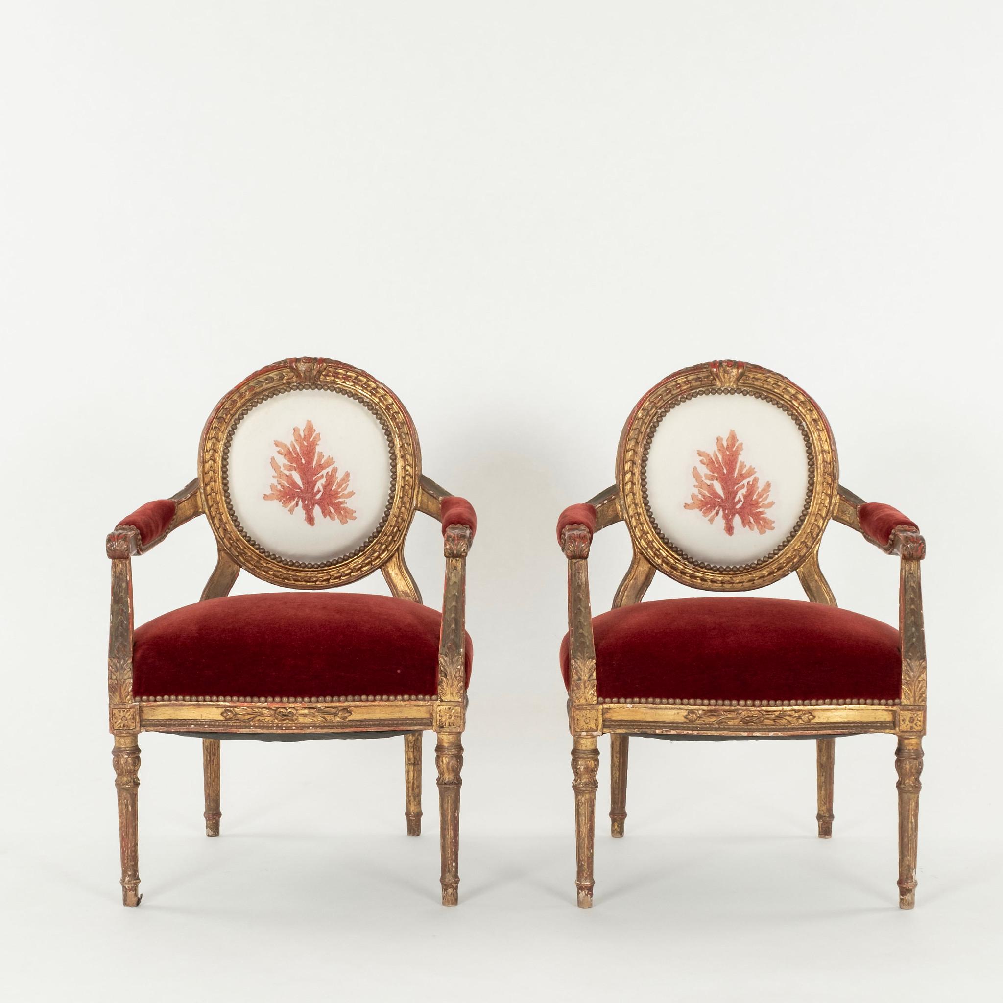 Pair of 19th Century or earlier Louis XVI Style fauteuils upholstered with coral motif inside backs, red mohair seats and on outside backs.