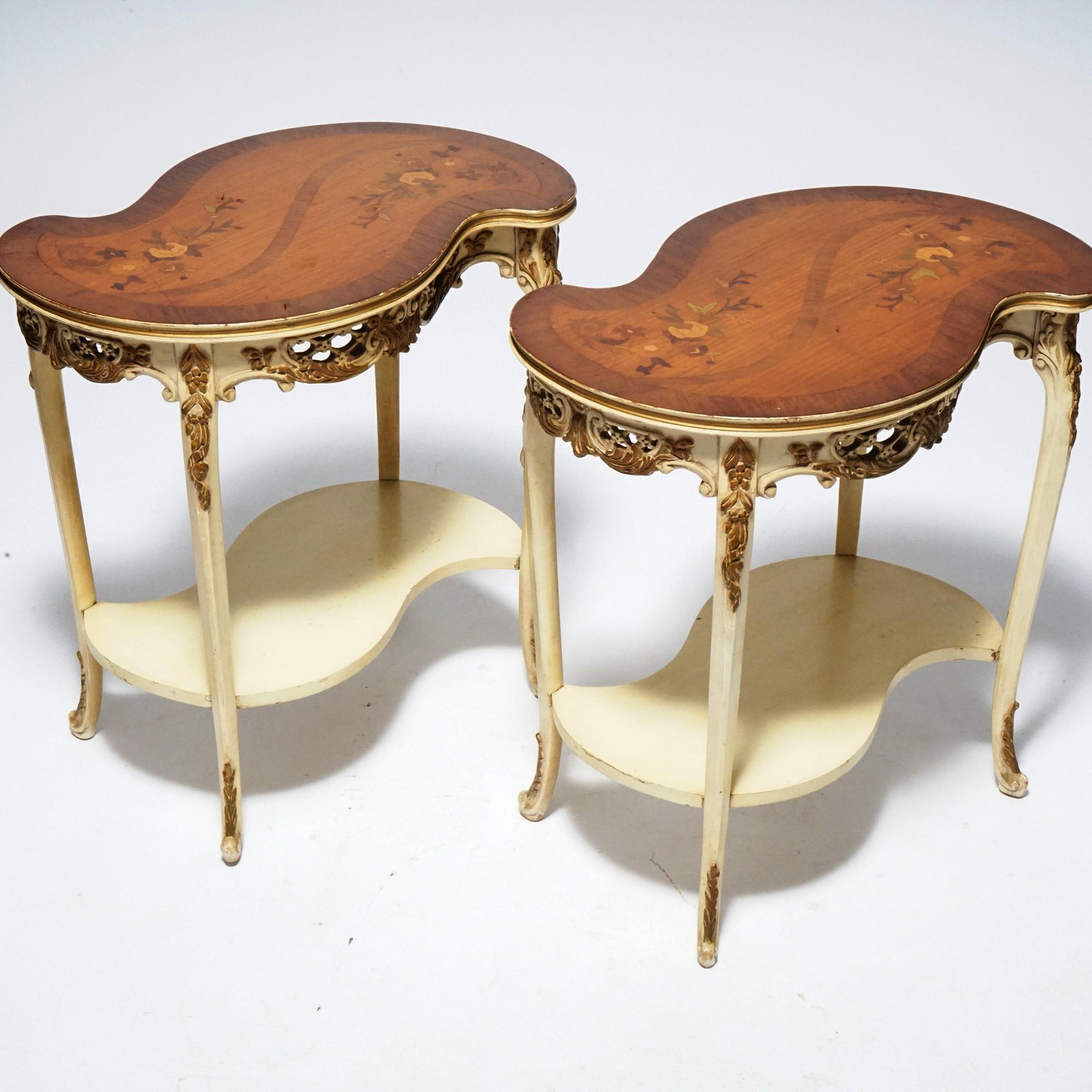 Antique pair of French Louis XVI style side stands offer serpentine form with satinwood floral marquetry tops over gilt decorated and painted bases with pierced skirt, cabriole legs and scroll form feet, c1930.

Measures- 25.25''H x 24.75''W x