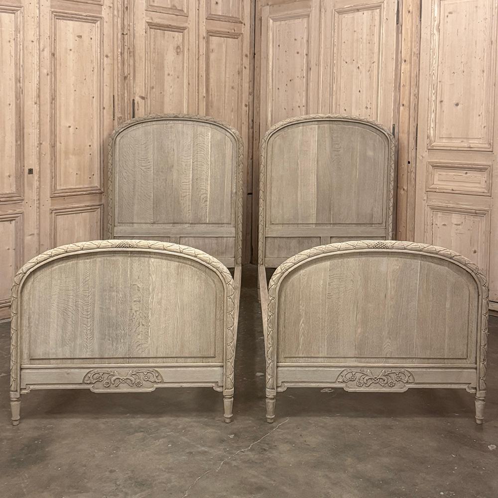 Pair French Louis XVI Twin Beds in Stripped Oak are a wonderful find, indeed!  Hand-crafted from dense, old growth oak, the pair has been designed to last for generation after generation.  The tailored, classically-inspired architecture includes a