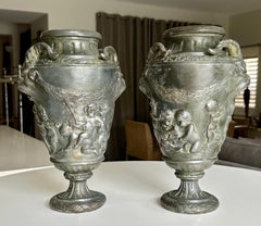 Pair French Metal Urns With Satyr and Putti