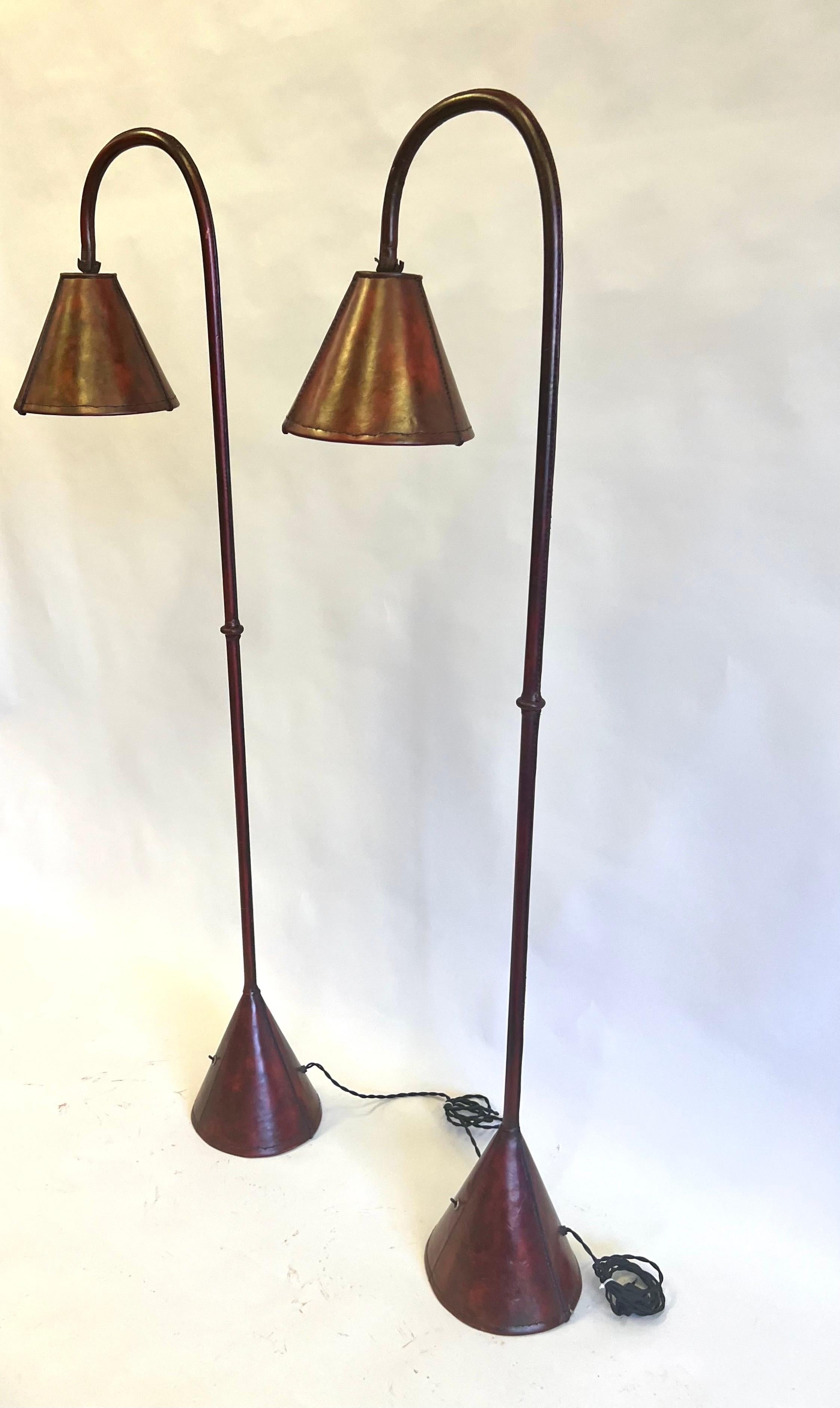 Mid-Century Modern Pair, French Mid-Century Burgundy Stitched Leather Floor Lamps by Jacques Adnet For Sale