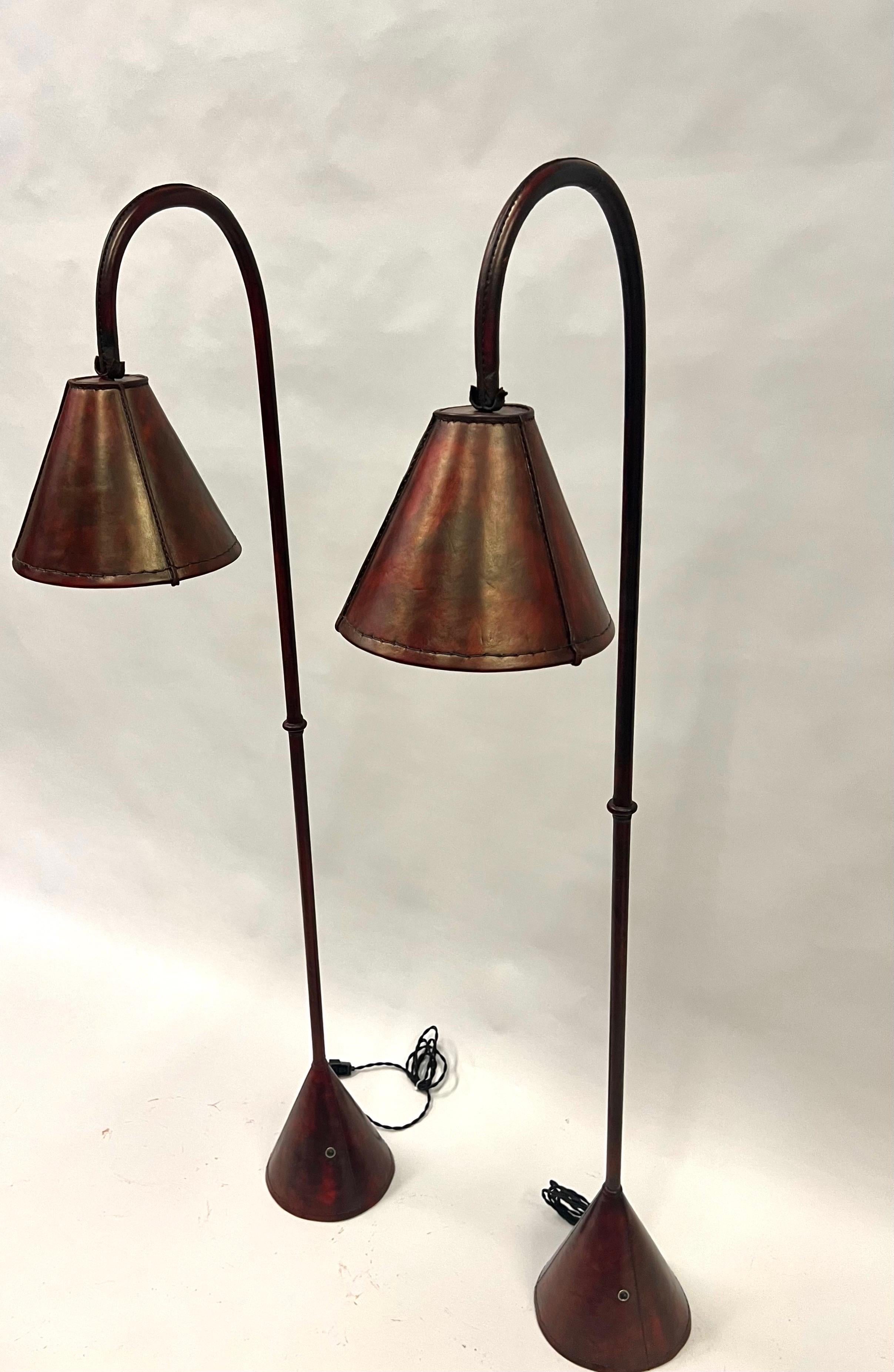 Pair, French Mid-Century Burgundy Stitched Leather Floor Lamps by Jacques Adnet In Good Condition For Sale In New York, NY