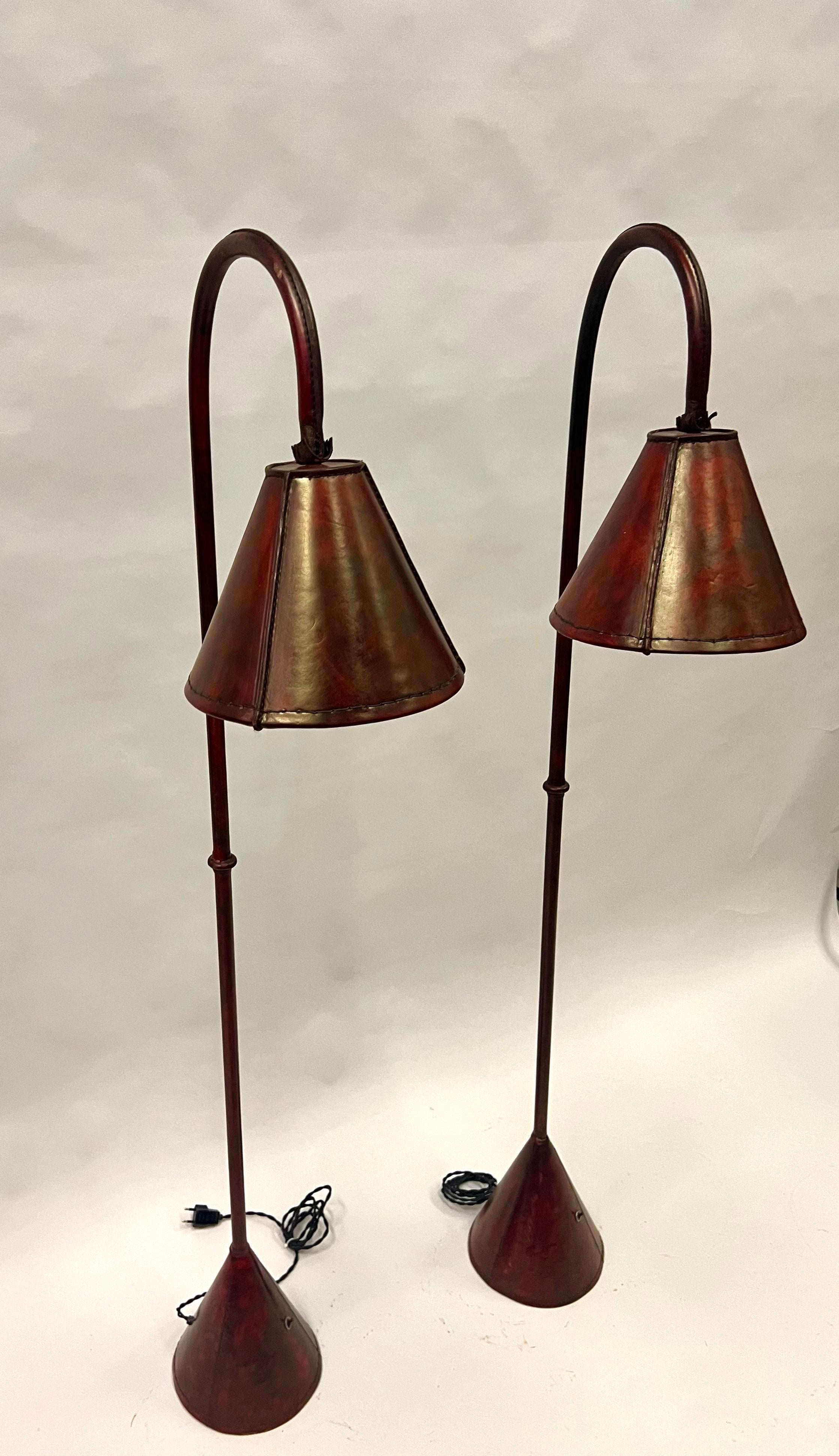 20th Century Pair, French Mid-Century Burgundy Stitched Leather Floor Lamps by Jacques Adnet For Sale
