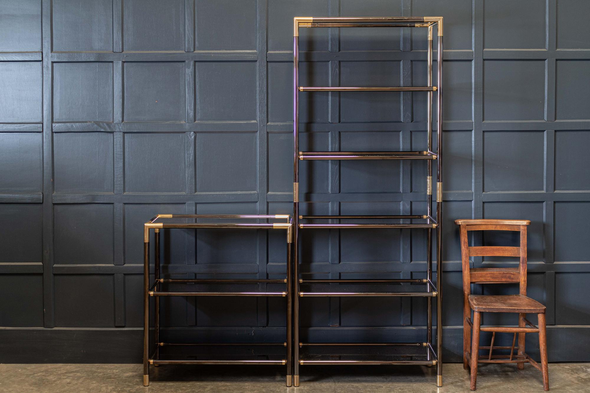 Pair of French mid century etageres shelving
Circa 1960's.

Pair of French mid century etageres shelving in the Maison Jansen’s style. Gunmetal and brass joints with original bronze mirrored glass shelves

(one shelf has a nibble to one the