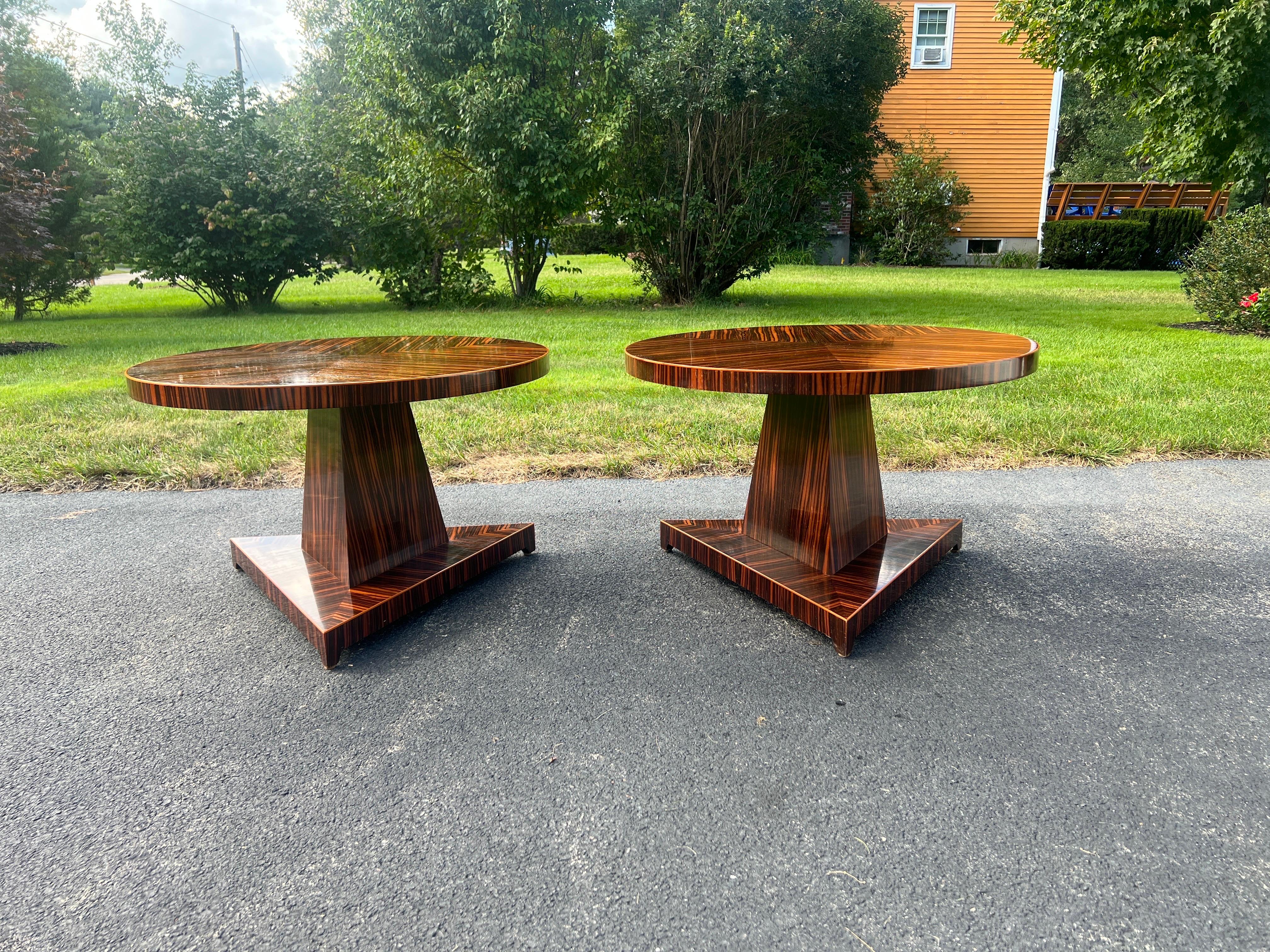 Pair, French Modern Art Deco Style Madagascar Rosewood Side Tables.

Each table has a round top with absolutely magnificent rosewood book matched graining and light fruitwood border. Which rests on a pyramid support and triangular 3 foot base.