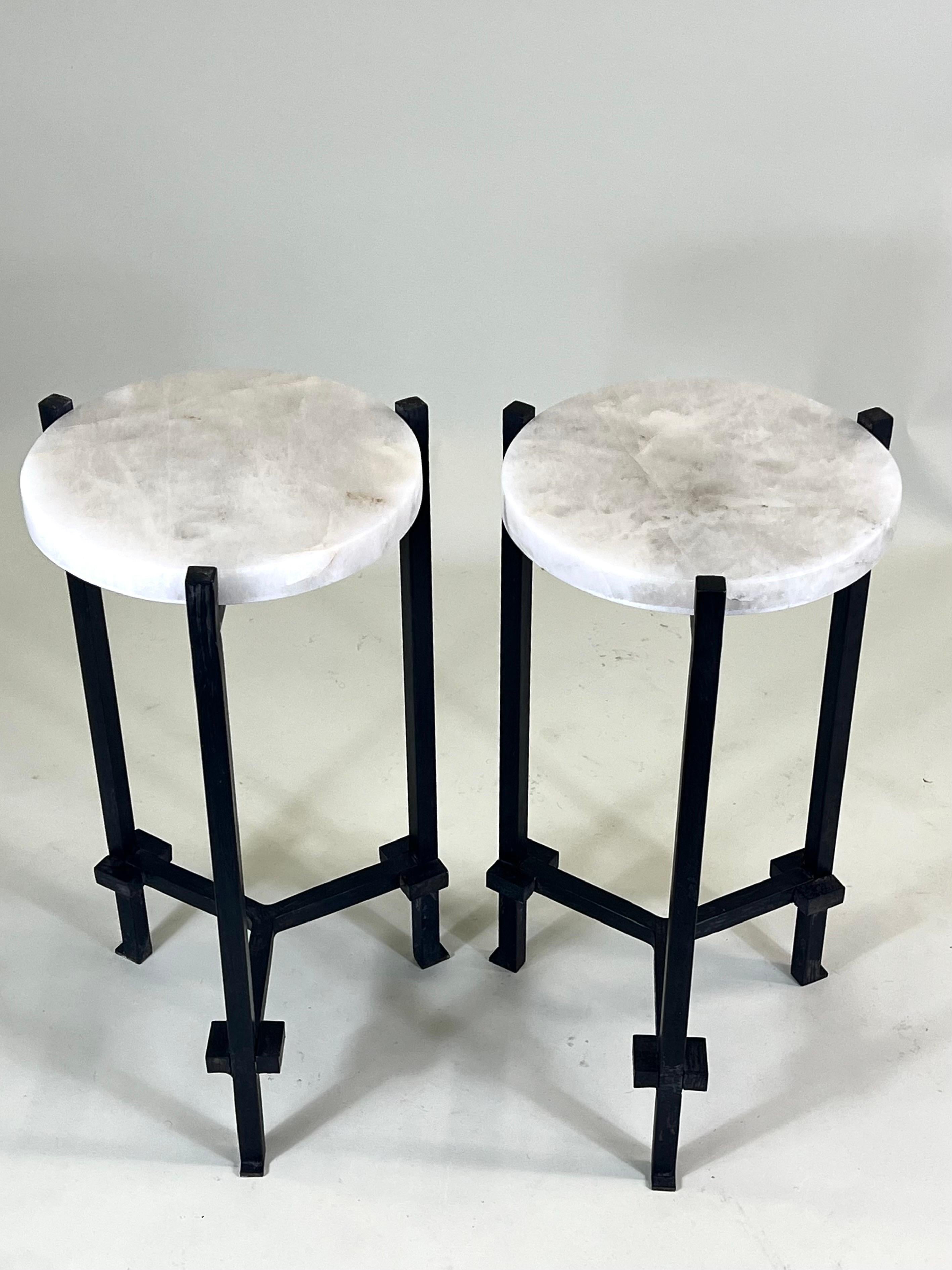 Rare, elegant and timeless Pair of French Mid-Century Modern Neoclassical Side Tables in Hand Wrought Iron and Rock Crystal attributed to Marc du Plantier. The end tables are hand made and composed in a rare and original tripod form. Their