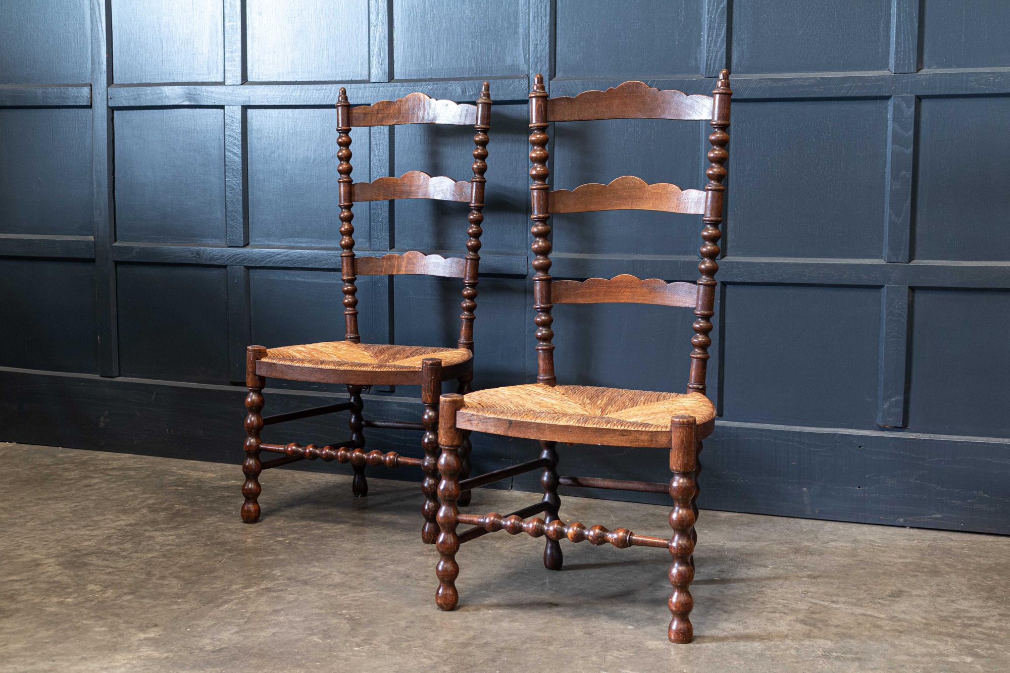 Circa early 20th C

Pair French oak provincial rush bobbin chairs.

Sourced from the south of France.
Price for the pair.

   

Measures: W 45.5 x D 41 x H 95.5cm
Seat height 38cm.