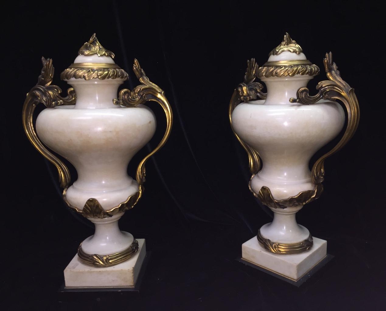 Exquisite pair of 19th century French Louis XV style ormolu mounted carved white marble urns signed E. Kahn
Meticulous attention has been given to every details.