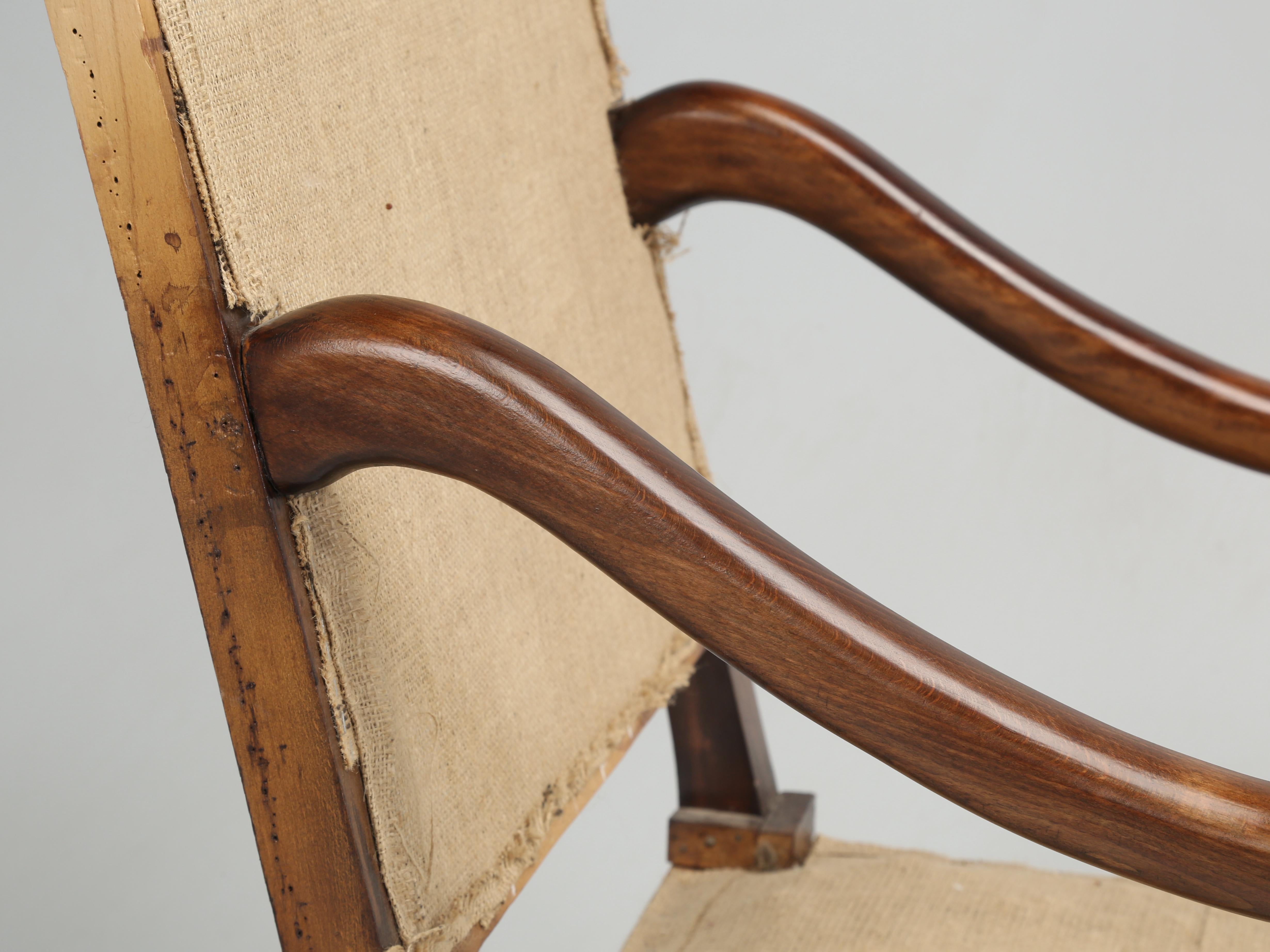 Pair of French Classic Os De Mouton Arm Chairs that are old enough to have been assembled with wood pegs. When we see the wooden peg construction it generally indicates that the chairs were made in the early 1900's or before. Our inhouse Old Plank