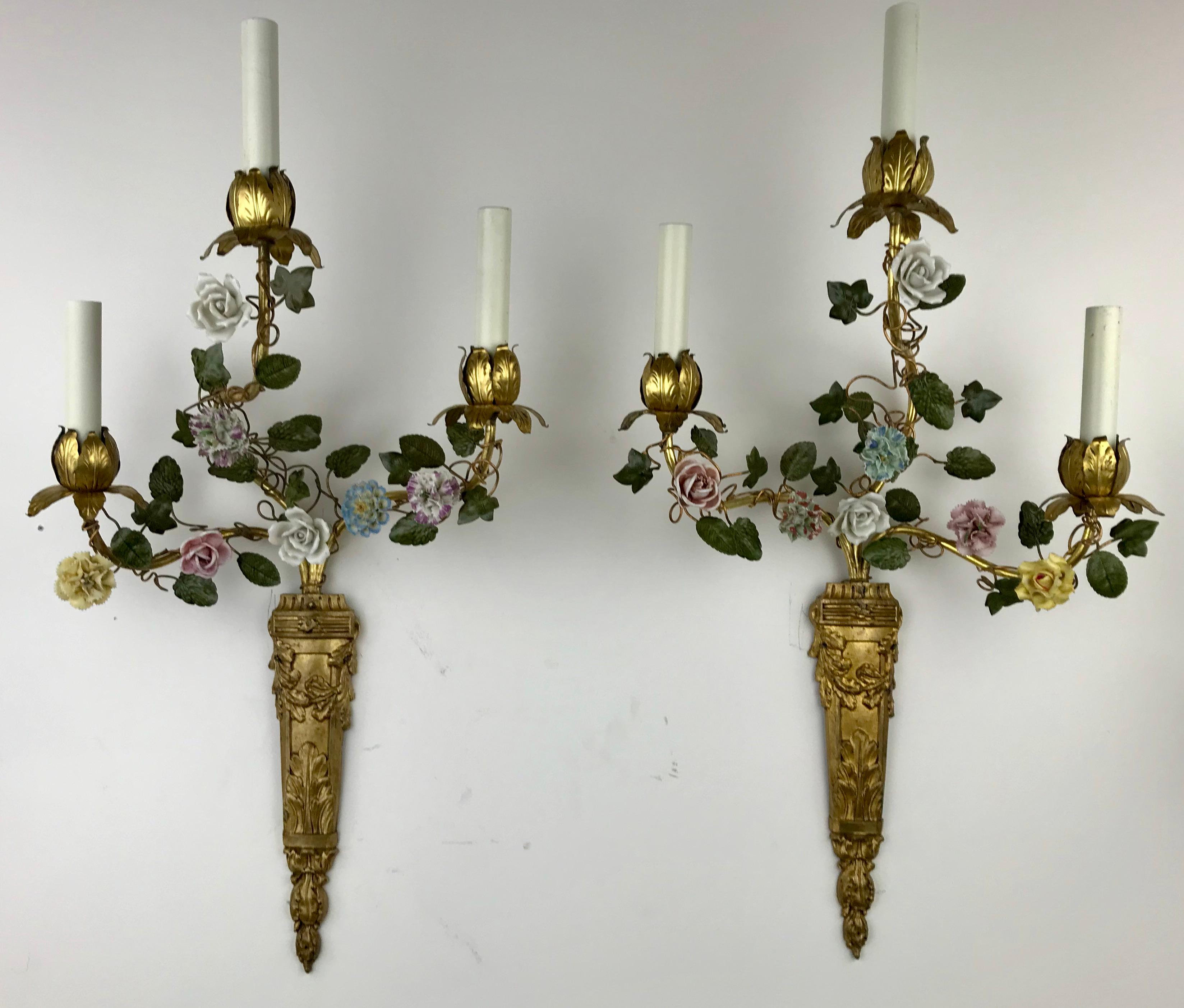 This beautiful pair of French three arm sconces feature naturalistic foliate branches with hand painted porcelain flowers.