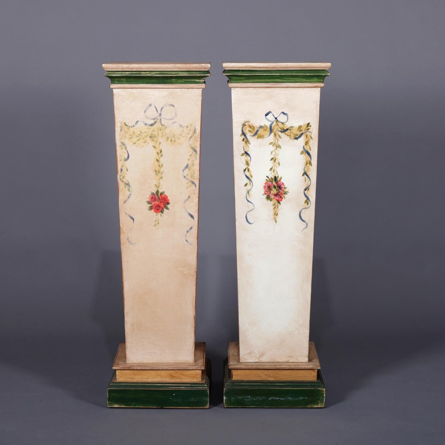 Pair of French Provincial sculpture display pedestals feature square and flared form hand painted with ribbon, floral and garland decoration, 20th century.

Measures: 40