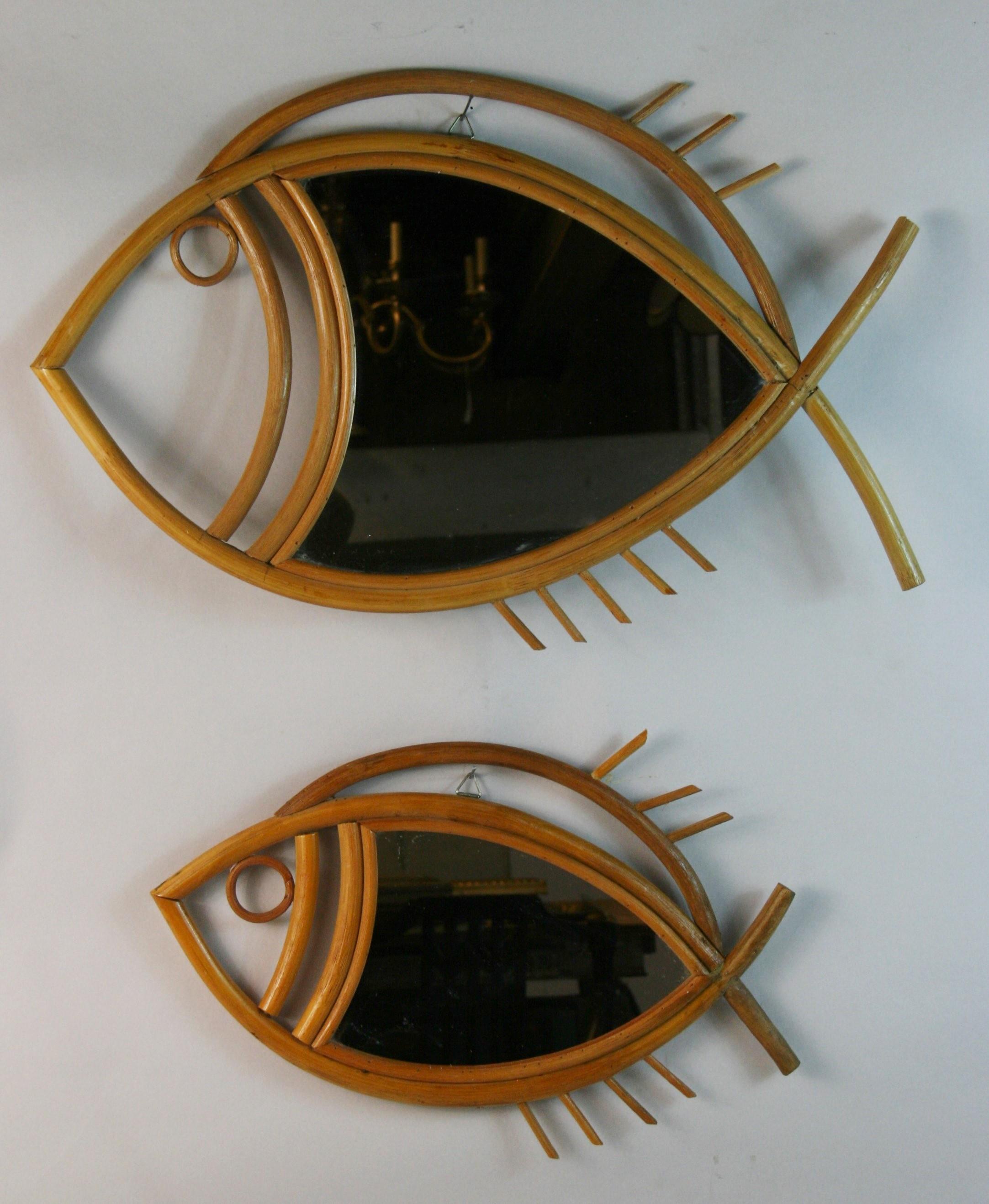 5227 Pair of unsual handcrafted rattan fish figure wall mirrors.
This spectacular pair of mirrors has a design combining the Mid century taste fron the French Riviera with oriental accents
Large 22.5x15 x1.25