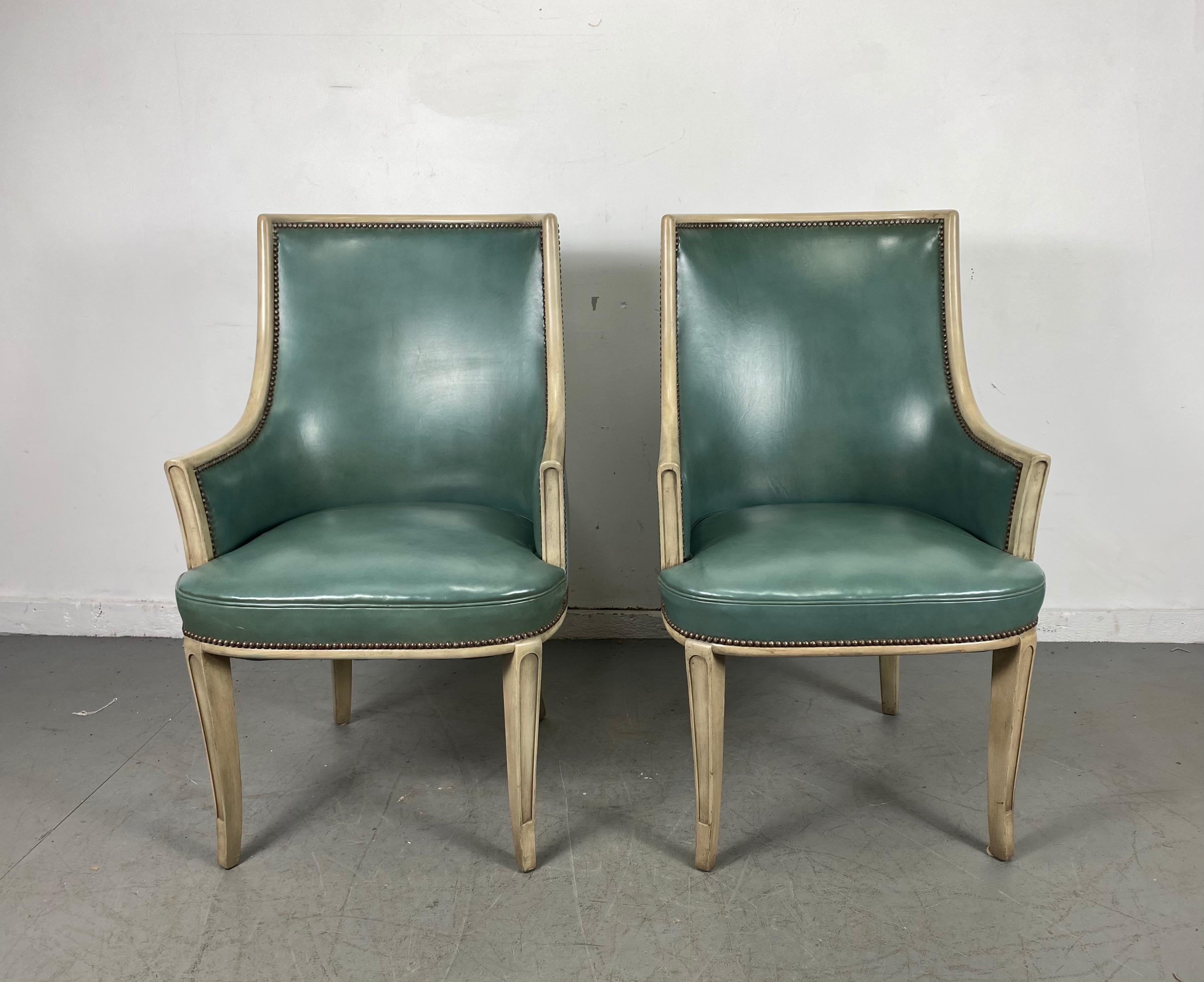 Pair of French Modern- Regency leather arm / lounge chairs, attributed to Baker Furniture Co. superior quality and construction, amazing color, blue/green leather, stunning pickled/ cerused frames. Extremely comfortable. 25