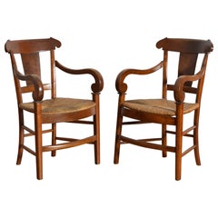 Pair French Restauration Walnut Armchairs, Rush Seats, 1st quarter 19th century