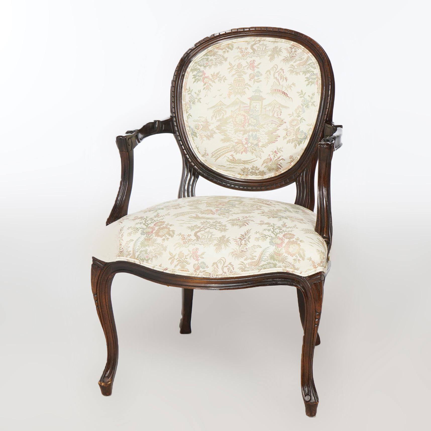 A pair of French style side chairs offer mahogany frames with upholstered backs and seats, scroll form arms and raised on cabriole legs, 20th century

Measures- 35''H x 22.5''W x 28''D; seat height 19.5