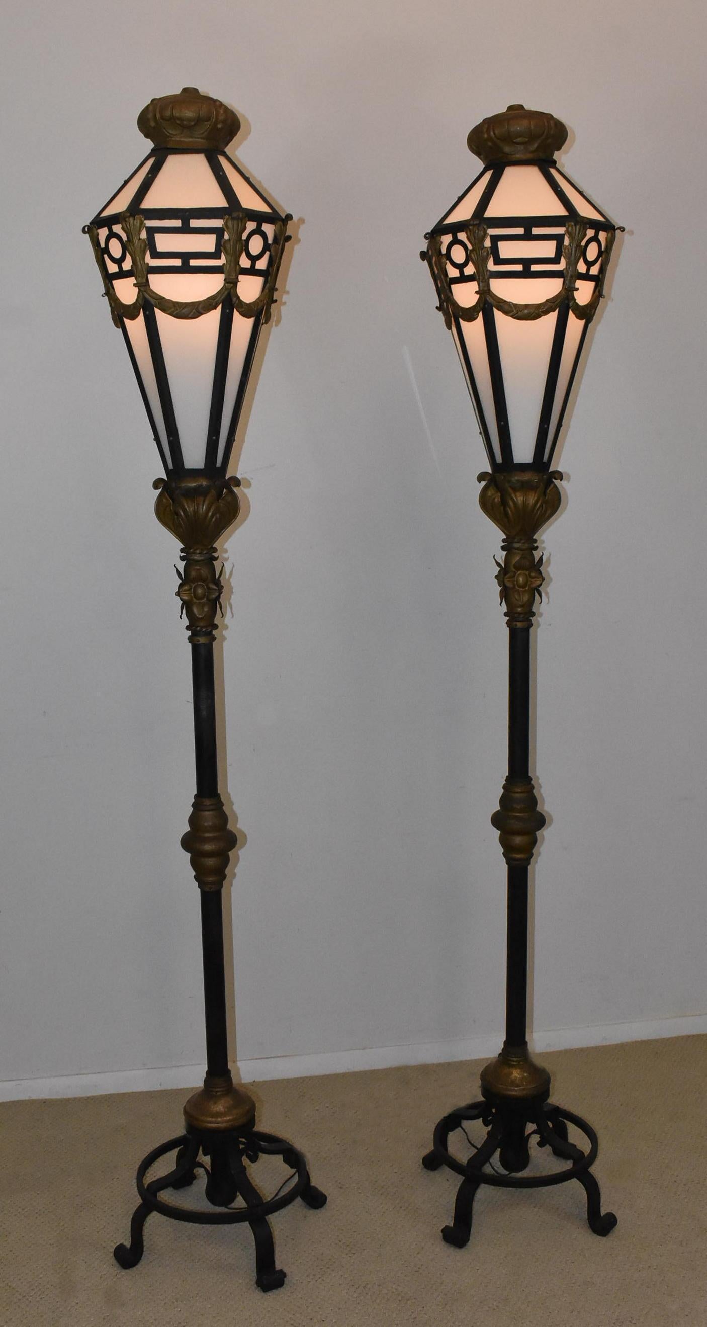Pair of heavy wrought iron and brass circa 1910 street lights / lamps. Hammered surface with decorative applied pieces. Shades are 30