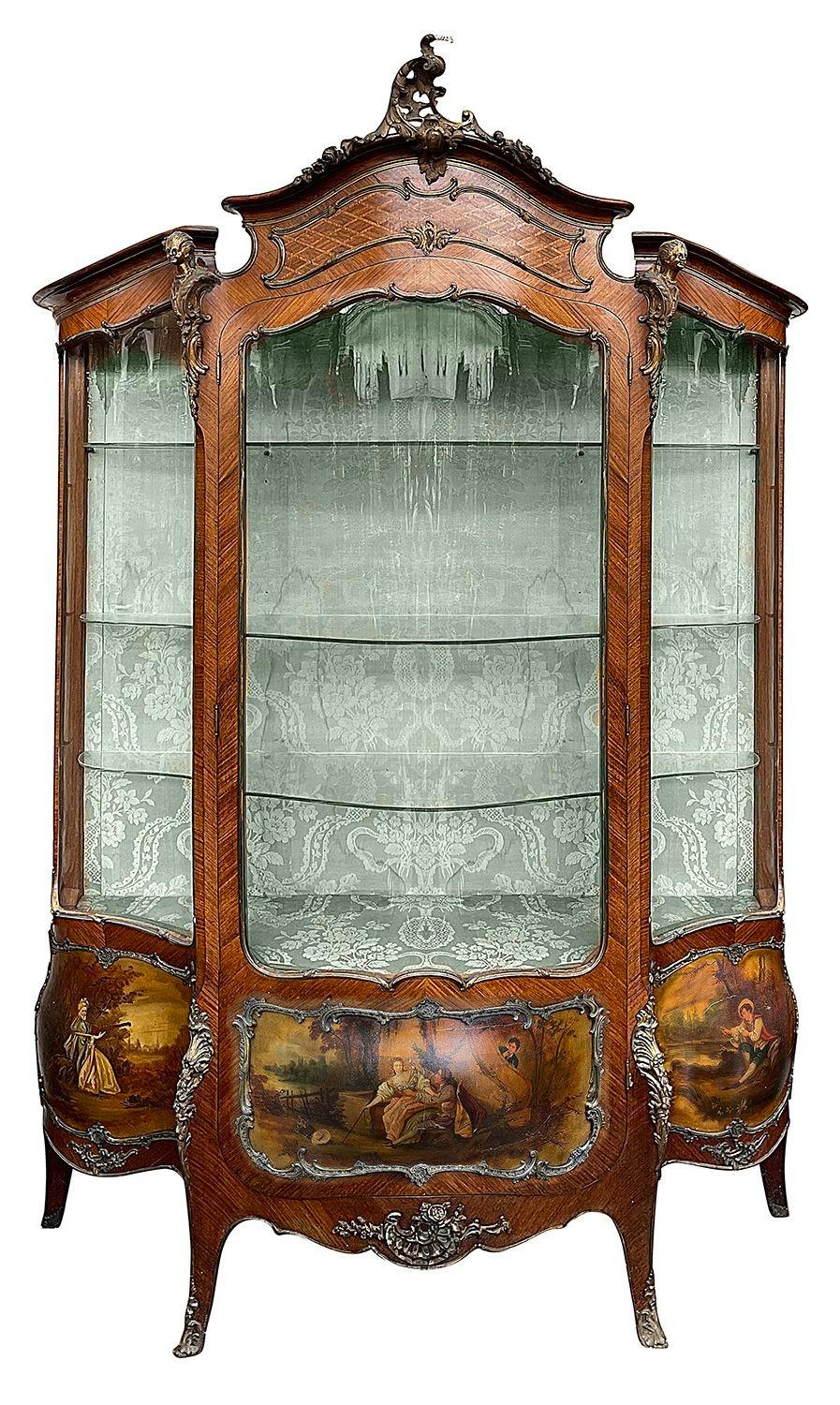 Matched pair of 19th Century French Kingwood serpentine fronted vitrines, each with classical gilded ormolu mounts, adjustable shelves within, Verni Martin hand painted panels depicting romantic scenes, and raised on out swept legs, terminating in