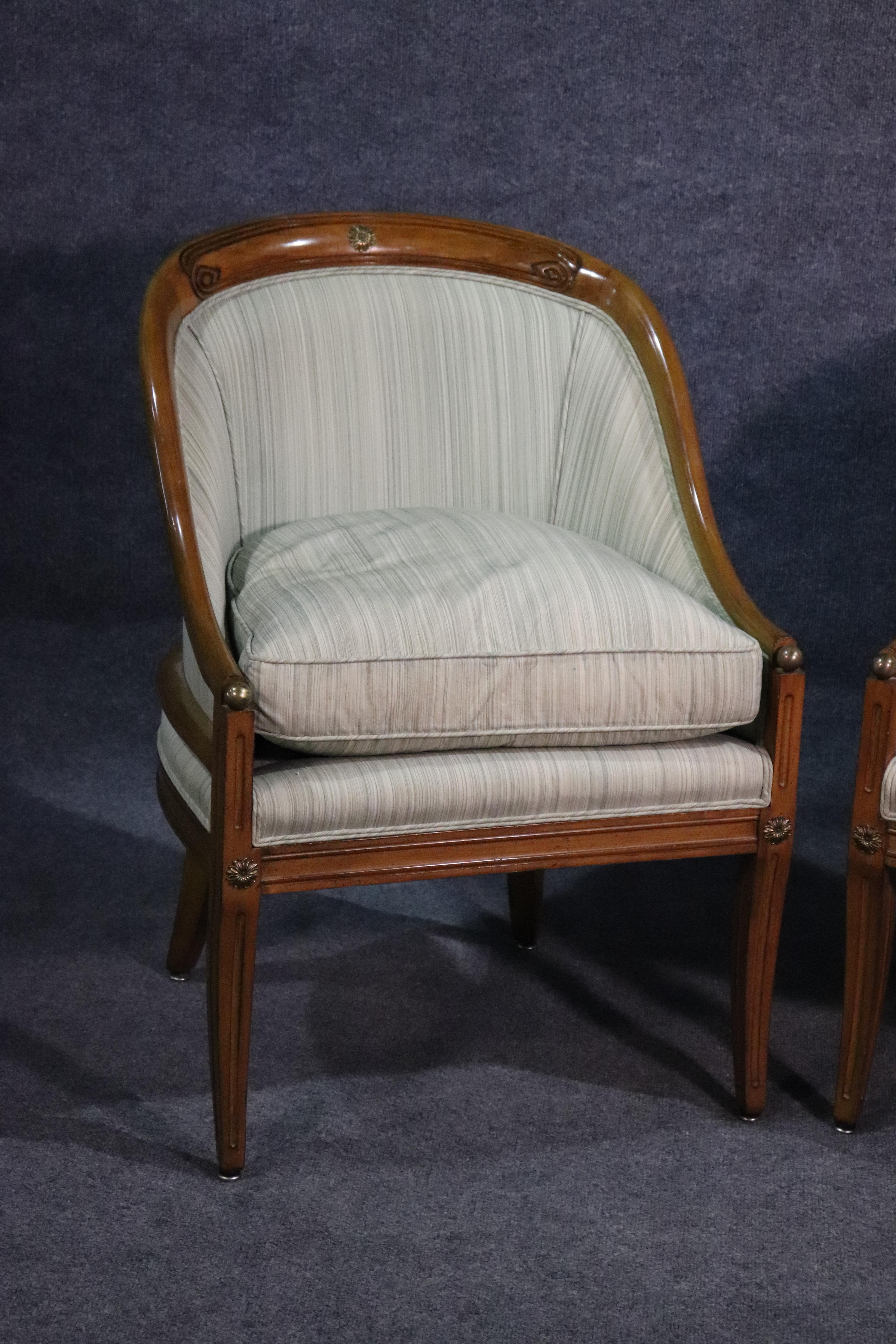 This is a fine pair of French bronze and brass mounted bergère chairs with goose feather filled cushions. They are in good condition with beautifully understated bronze and brass details.
They measure 32 tall x 22.5 wide x 23.5 deep.
The seat