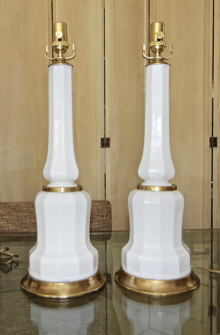 Pair of French 1940s white opaline glass table lamps with brass bases and fittings. Rewired with new 3 way sockets and cords.