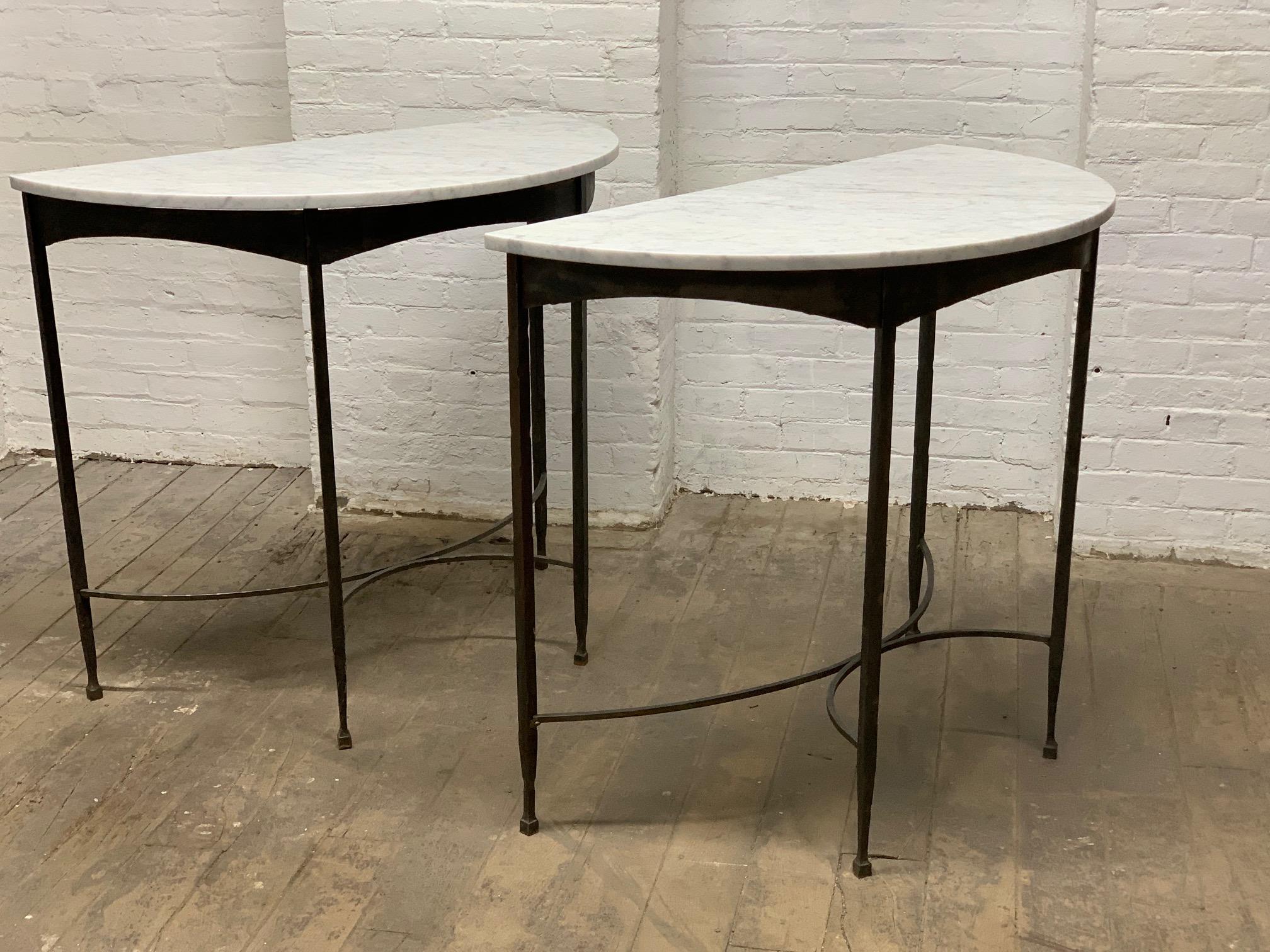 Pair of French wrought iron and Carrara marble-top demilune / console tables. Great look for outdoors as well.