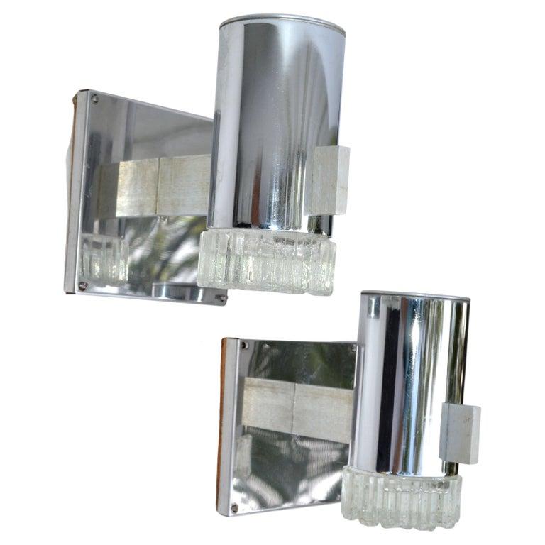 Italian Gaetano Sciolari chrome & cut glass sconces, wall lights Mid-Century Modern era.
US rewired and in working condition, each takes 1 light bulb max. 60 watts. 
Wooden Backing for secure Wall mounting. It measures 5.5 x 5.5