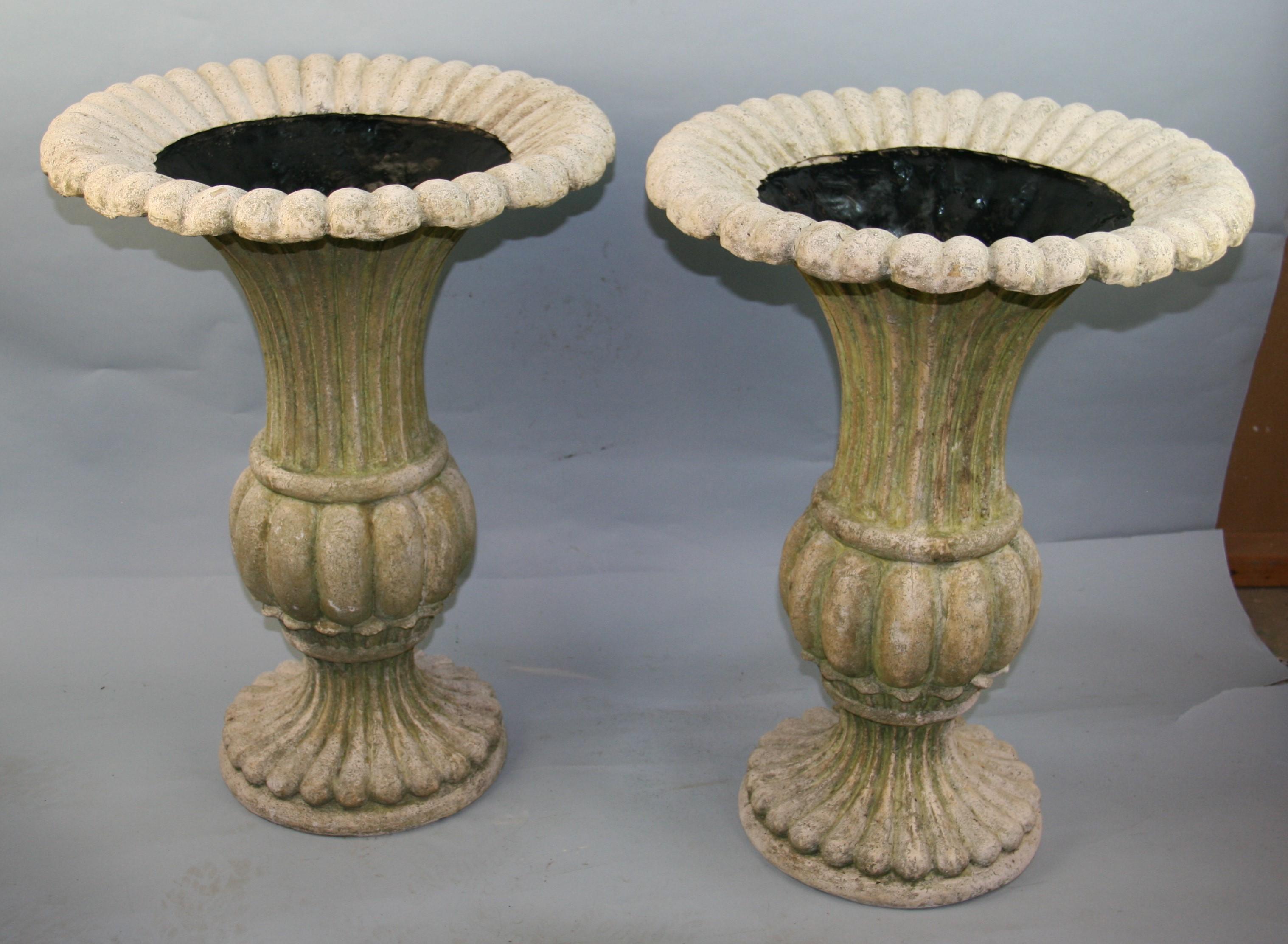 Pair light weight simulated stone planters.The look and texture of stone but not the weight
Aged patina.