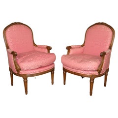 Pair Genuine French Carved Walnut Louis XVI Style Bergère chairs circa 1950s