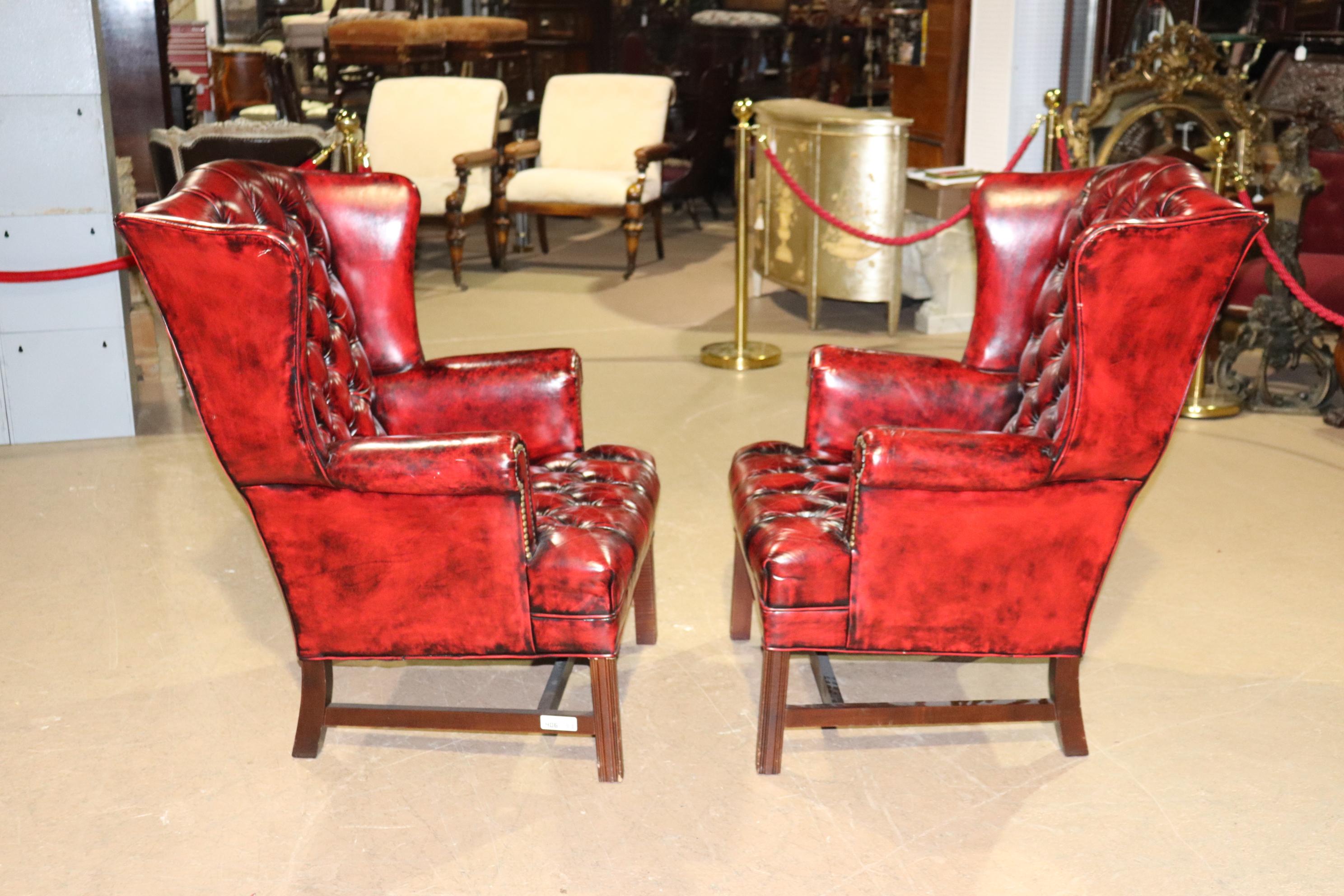 Late 20th Century Pair Genuine Leather Oxblood Chesterfield Chippendale Style Mahogany Wing Chairs