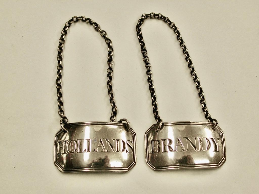Pair George 111 Silver Brandy and Hollands Labels Dated 1809 Joseph Willmore 
Assayed in Birmingham.
This pair of liquor labels have a wonderful patina and are in excellent condition
with original silver chains.