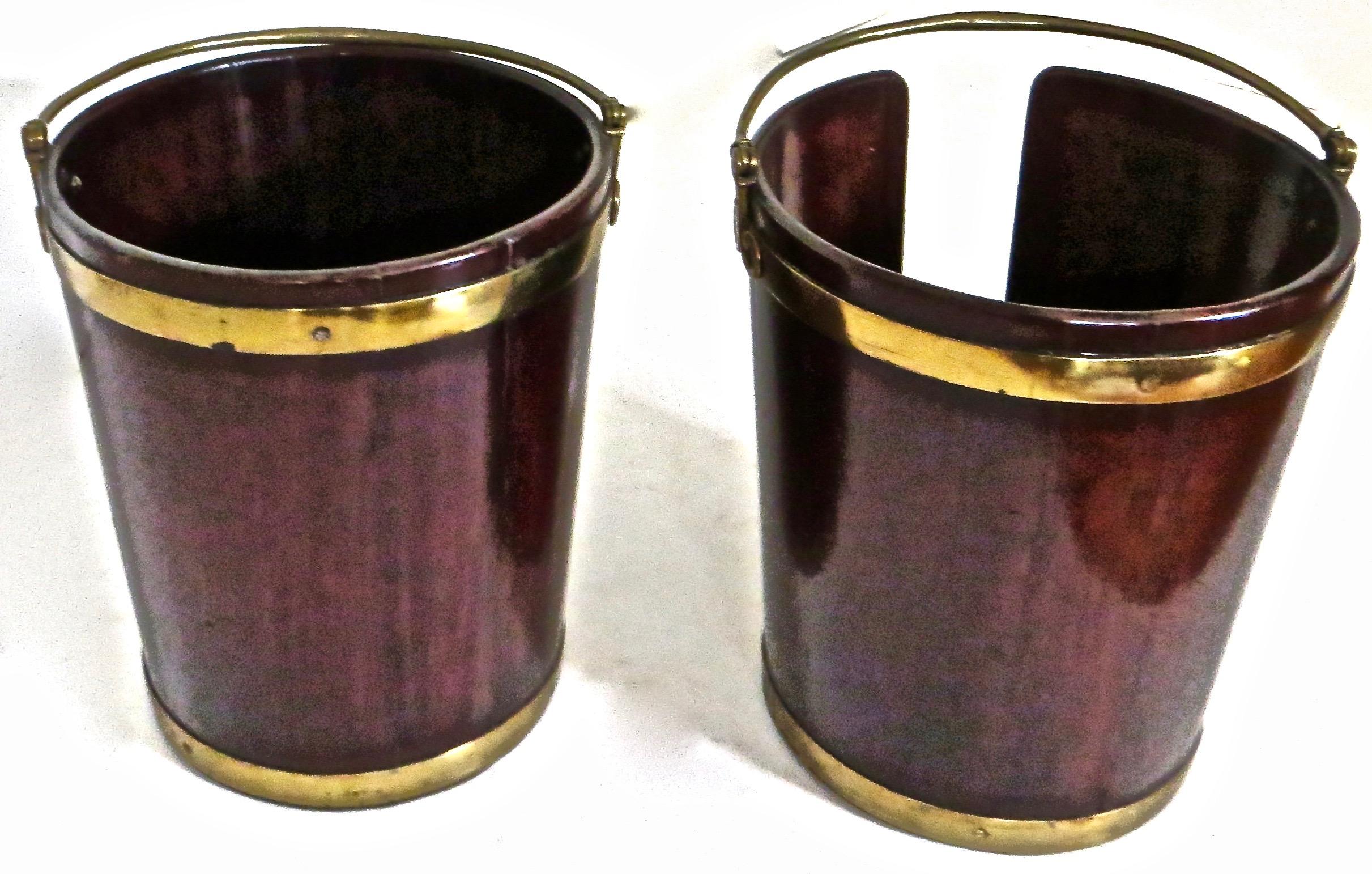 Pair of English Georgian mahogany brass-bound buckets, circa 1770. Buckets are well made, sturdy, and in excellent condition and completely original and intact. These handsome buckets are made of mahogany and brass bound with bands around the