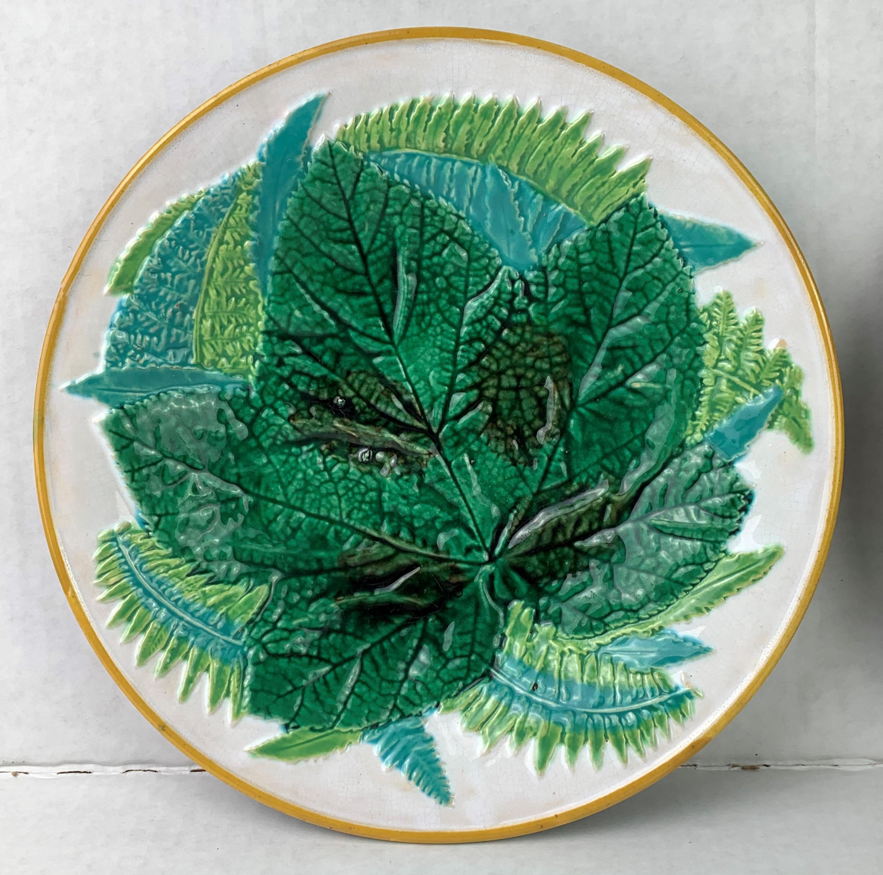 Pair (2) George Jones Majolica Leaf and Ferns Plates on a white ground, English, circa 1875, naturalistically molded with a central motif of a maple leaf surrounded by and ferns, glazed in varying shades of green and turquoise blue. Both with 'GJ'