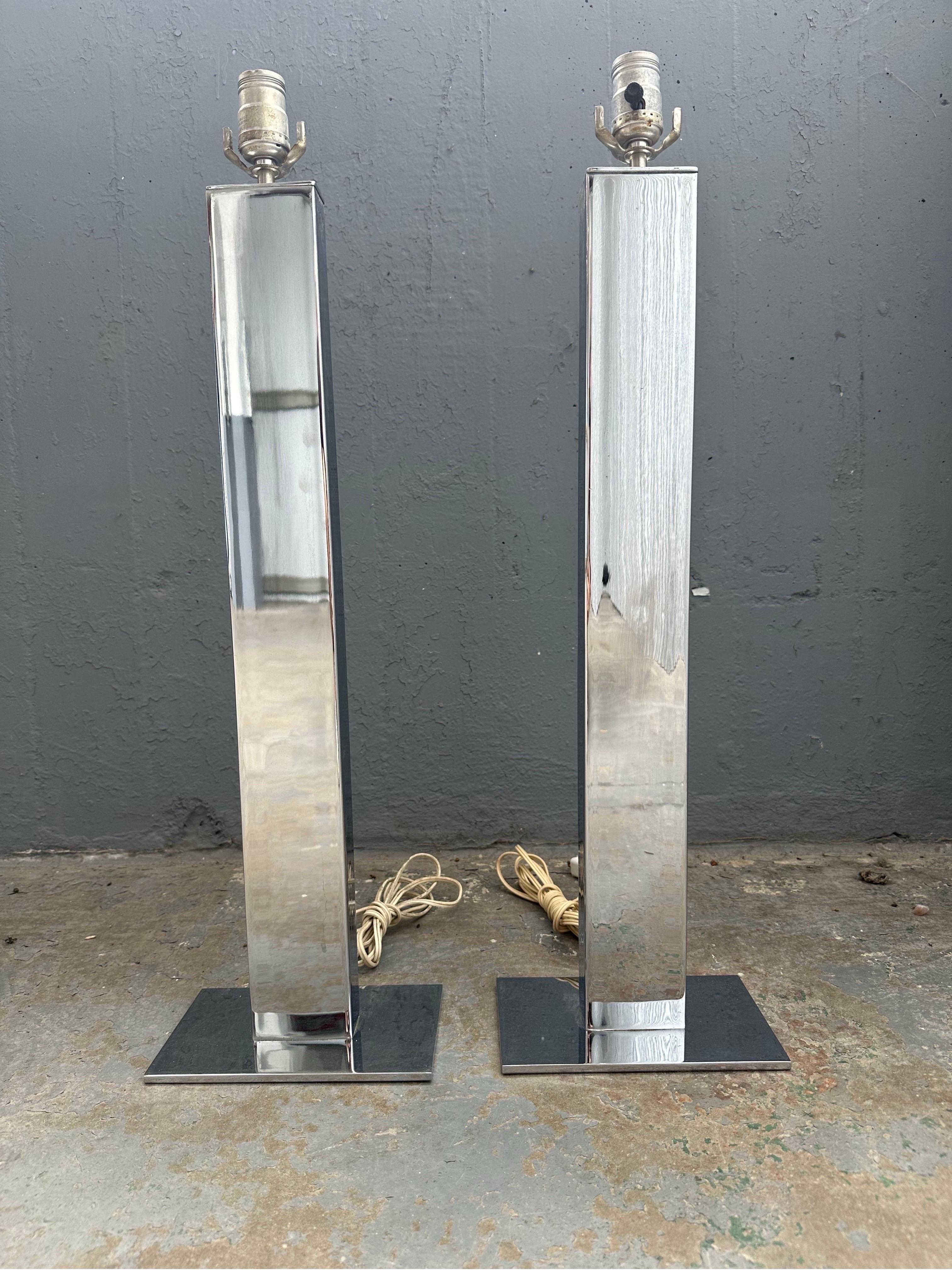 Chrome-Plated Steel George Kovacs Table Lamps. Featuring a slim, three foot, rectangular and heavy chrome-plated steel column on rectangular base. 28” to top of socket.