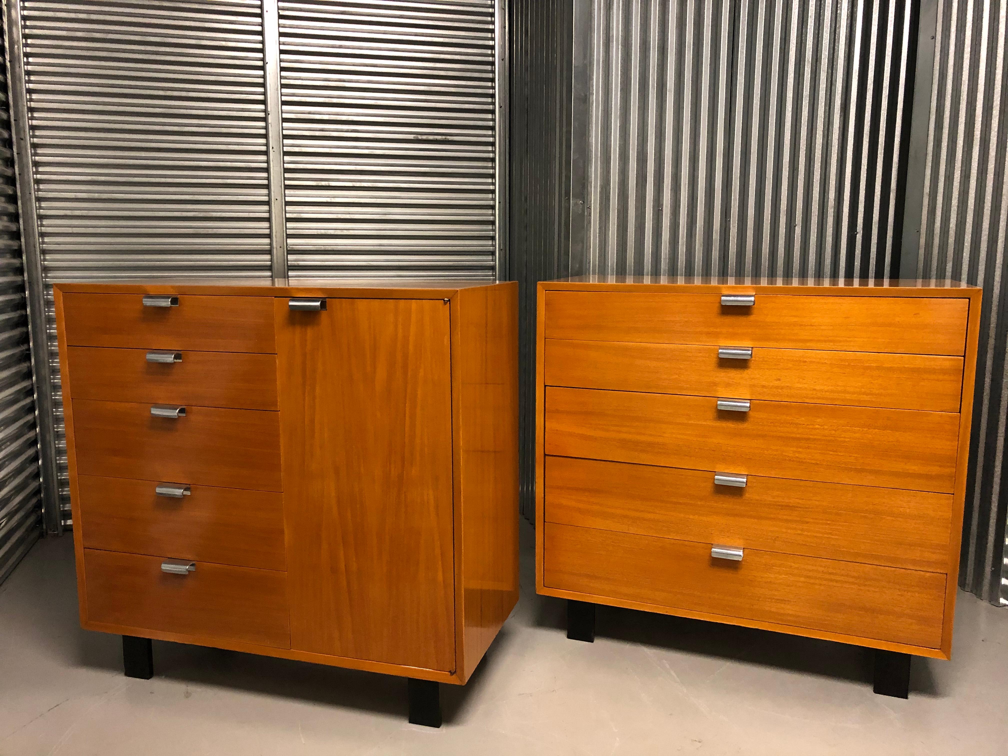 Pair of George Nelson for Herman Miller bureau cabinet storage units, polished handles light colored birch with and black feet.
