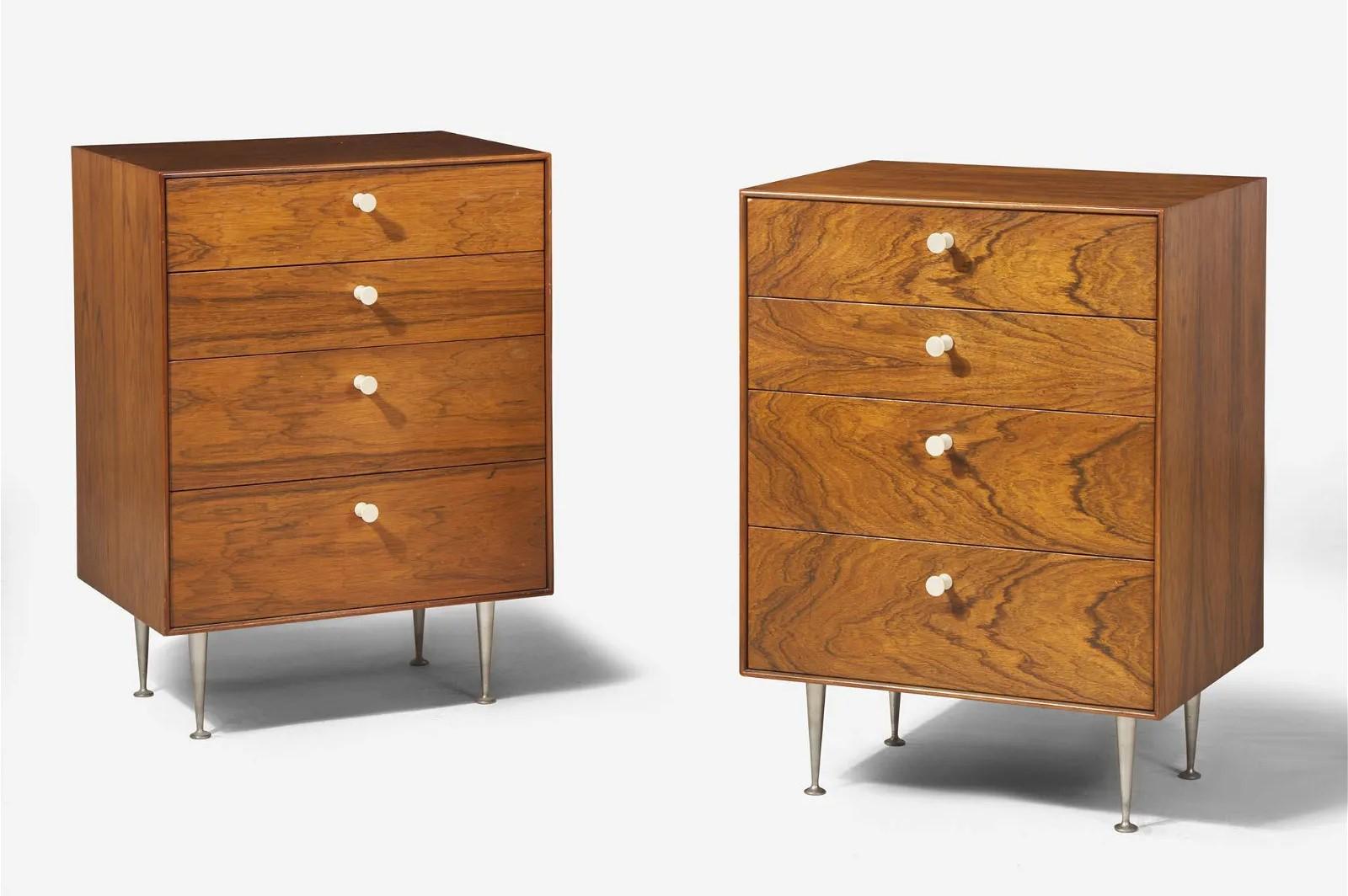 Pair of George Nelson thin edge chests or nightstands. The items are rosewood veneer with four pull-out drawers and metal legs.