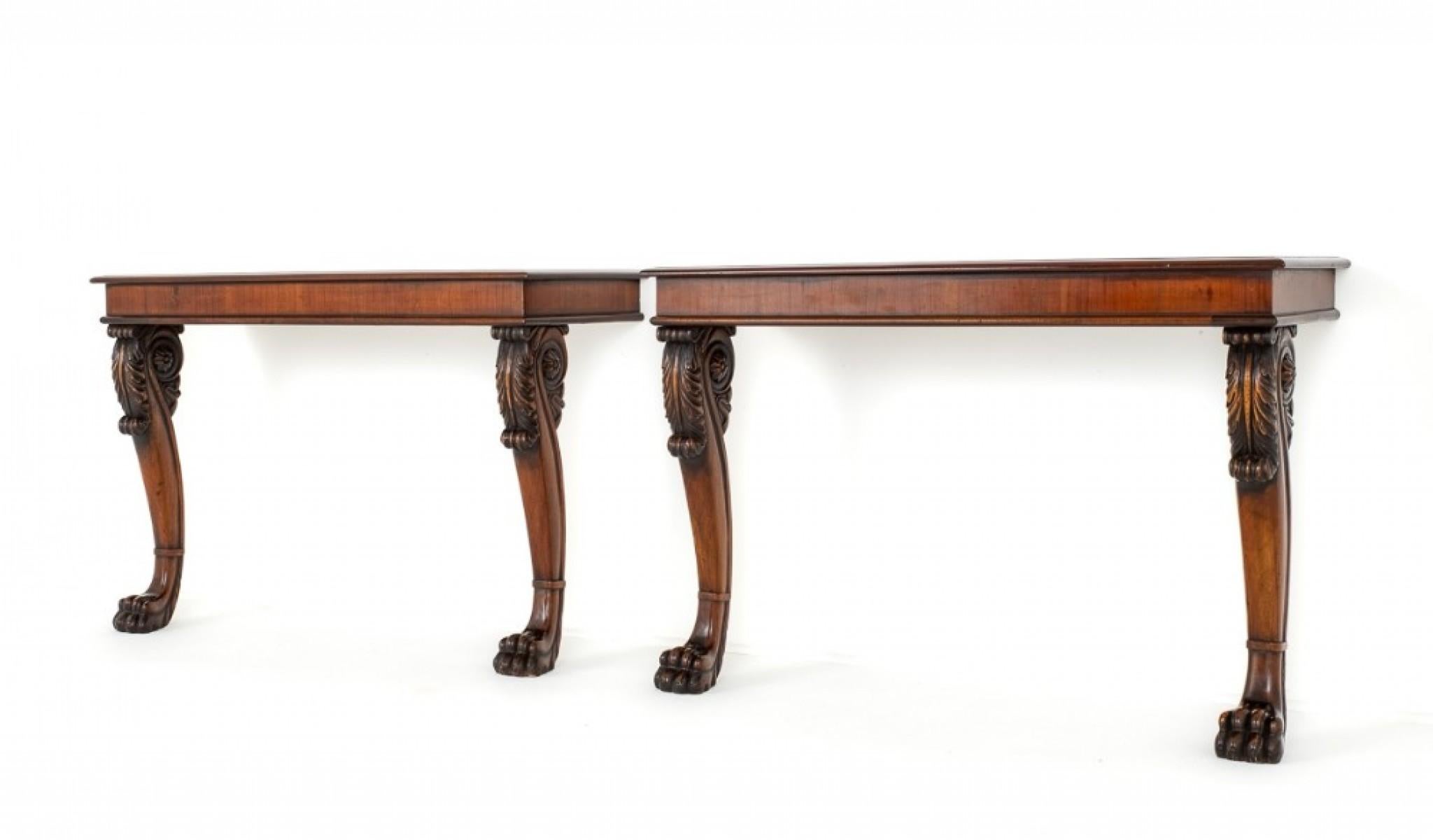 Pair of Georgian Revival Mahogany Console Tables.
circa 1880
These console Tables Feature Scroll Front Legs With Lions Paw Feet.
The Knees Feature Carved Acanthus Leaves.
These Lovely Tables would Grace any Home.
Presented in Good Condition.