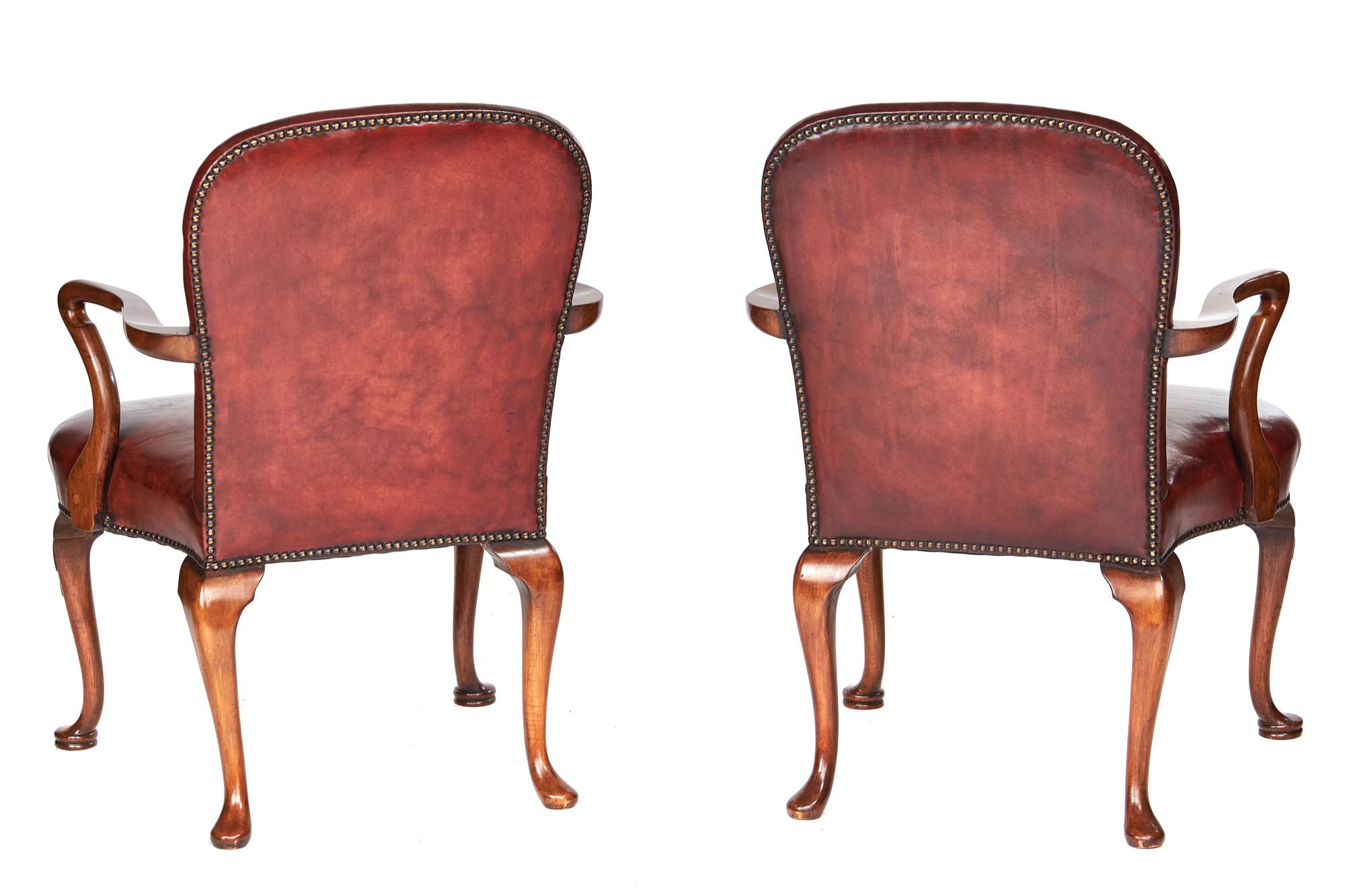 Pair Georgian revival walnut & leather open elbow chairs circa 1920s
Recently covered Leather upholstery, coloured to chestnut,
brass studded decoration,
Polished professionally by my French polishers i have used for over 30 years, 
Walnut open