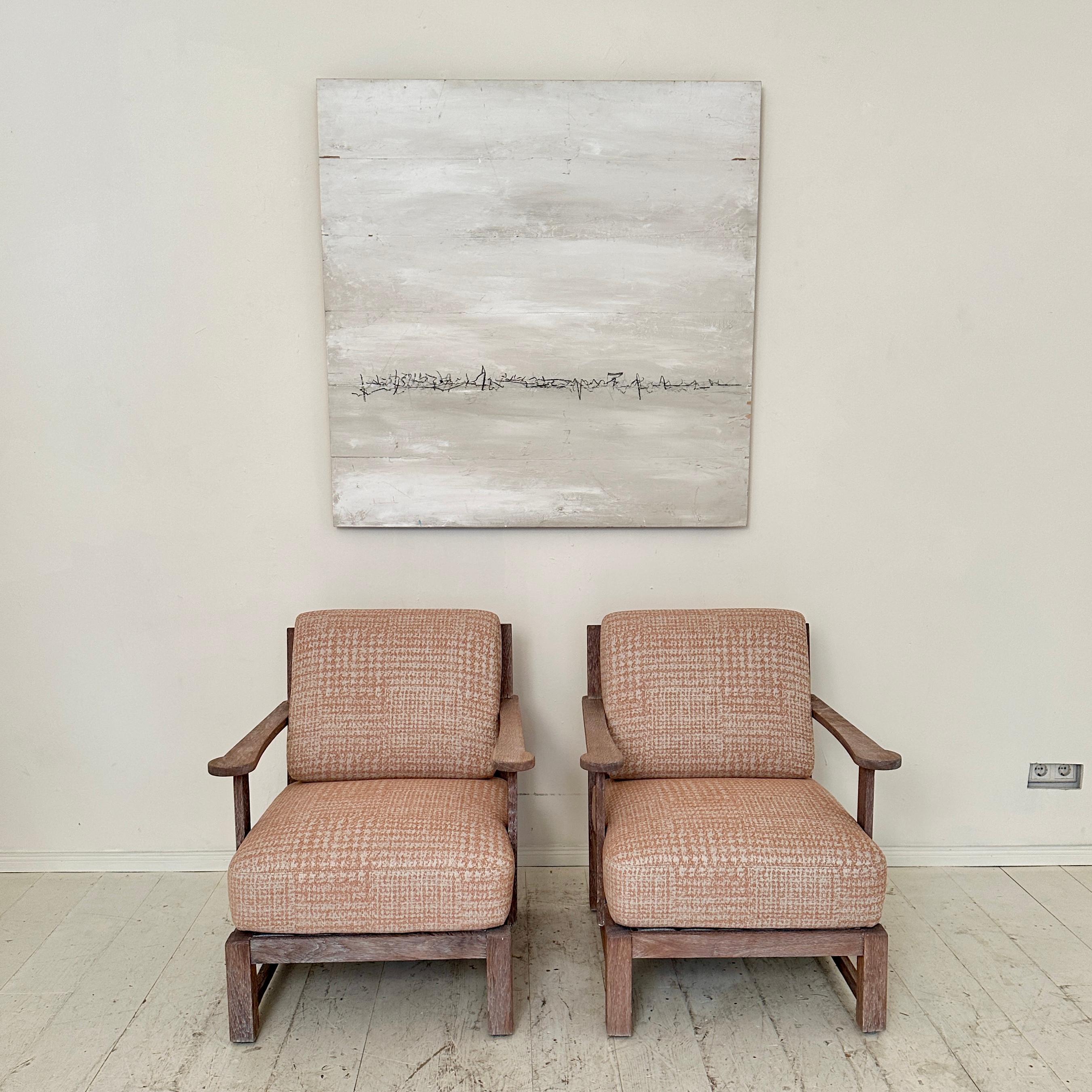 Crafted in 1920s Berlin, this pair of German Art Deco armchairs stands as a testament to the era's sophisticated design ethos. Meticulously constructed from solid oak, these chairs boast a timeless elegance that seamlessly merges form and function.