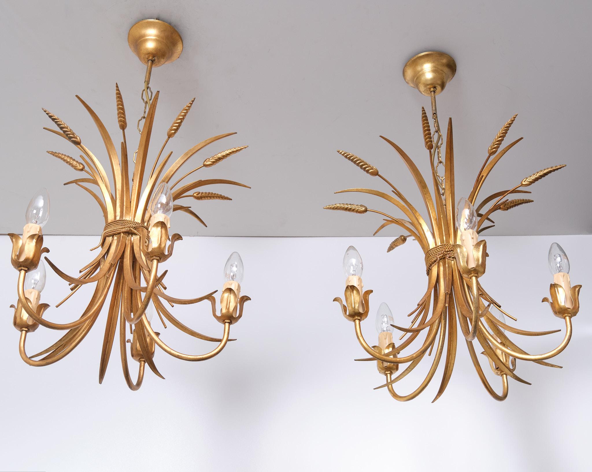 Beautiful pair of Gilded Brass Wheat Sheaf chandeliers . 5 arms 
signed . So stylish . Italy 1970s . good condition.   