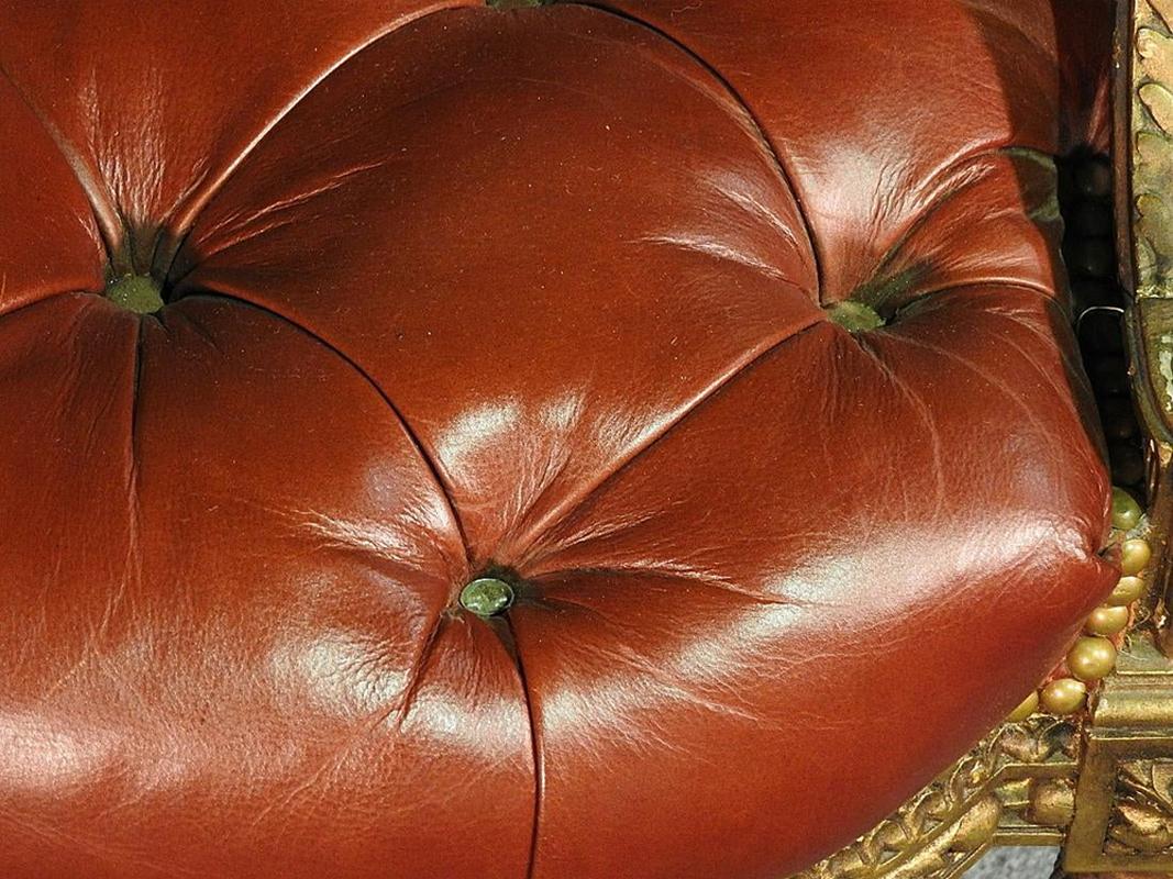 Louis XVI Pair of Gilded Carved Tobacco Brown Leather Tufted Fauteuil Armchairs circa 1920