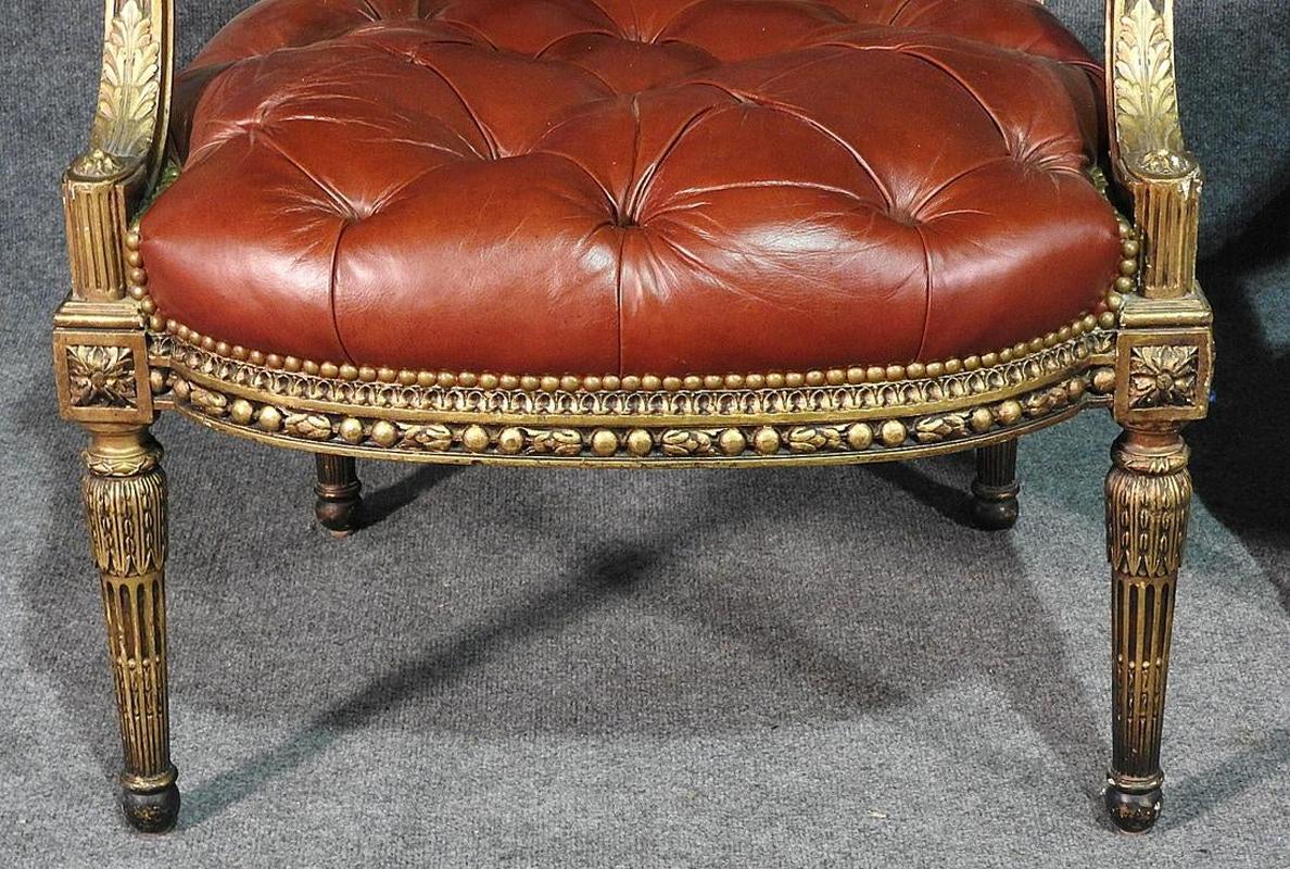 French Pair of Gilded Carved Tobacco Brown Leather Tufted Fauteuil Armchairs circa 1920