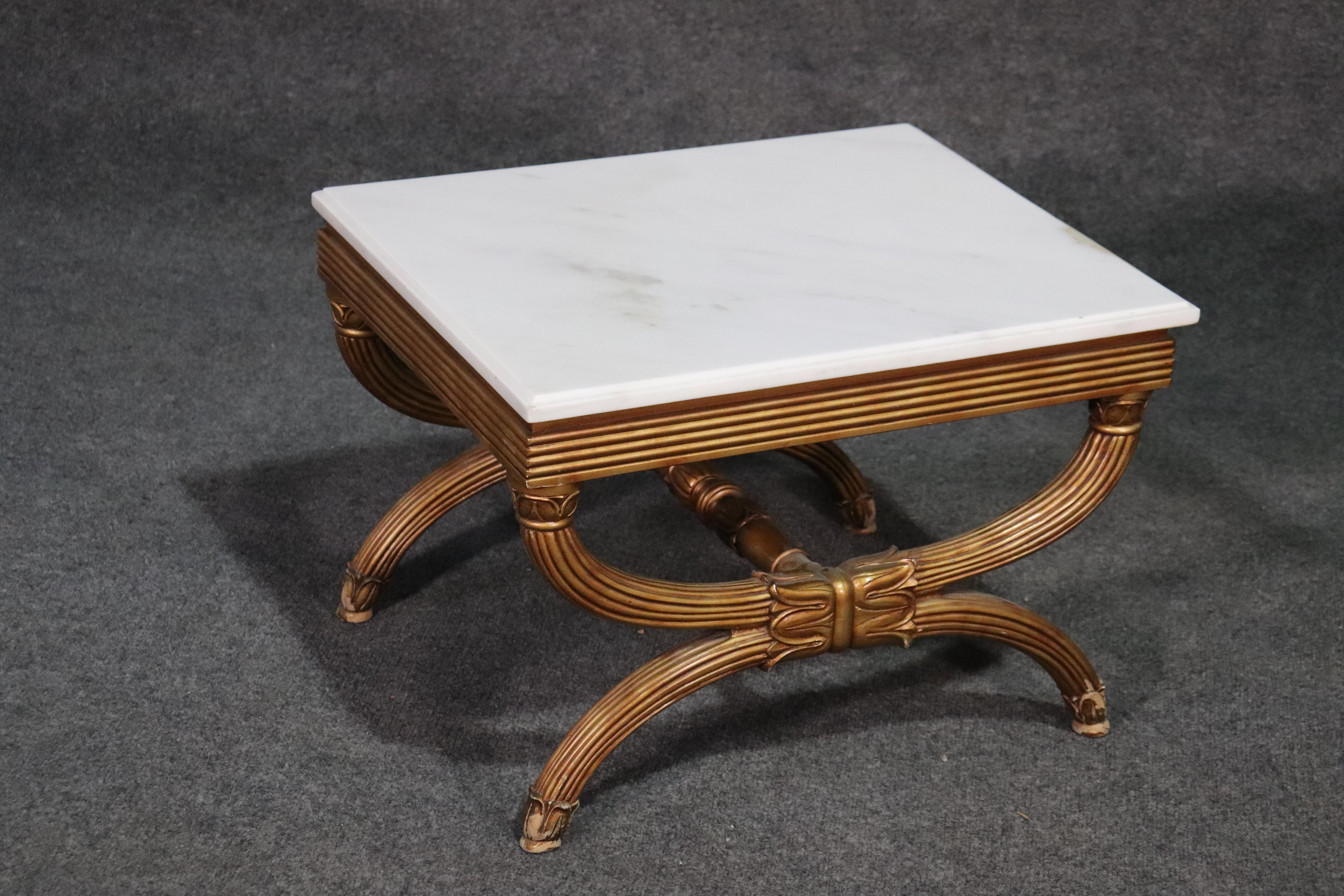 These are beautifully gilded tables with white marble tops. They can be painted in any color or left as they are. They date to the 1950s and are in good condition with minor gold losses around the legs. They each measure 23 wide x 19 deep x 18 tall.