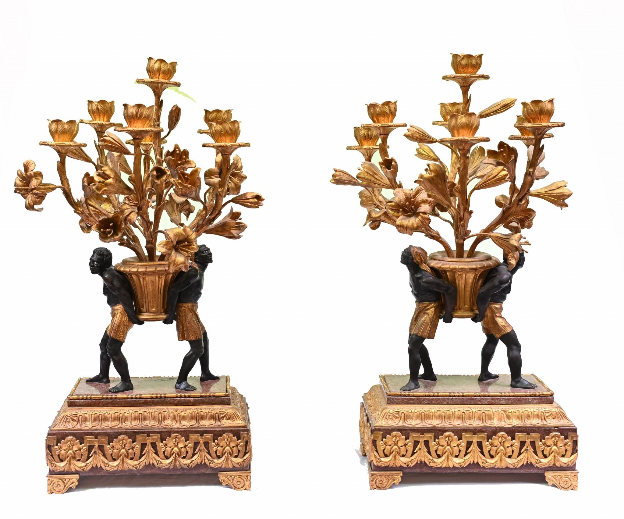 Elegant pair of blackamoor gilt candelabras from the Regency era
A pair of blackamoors to each stand holds aloft the candelabra branches which are interspersed with flowers
The casting is very ornate with a wonderful patina
Bought for a private