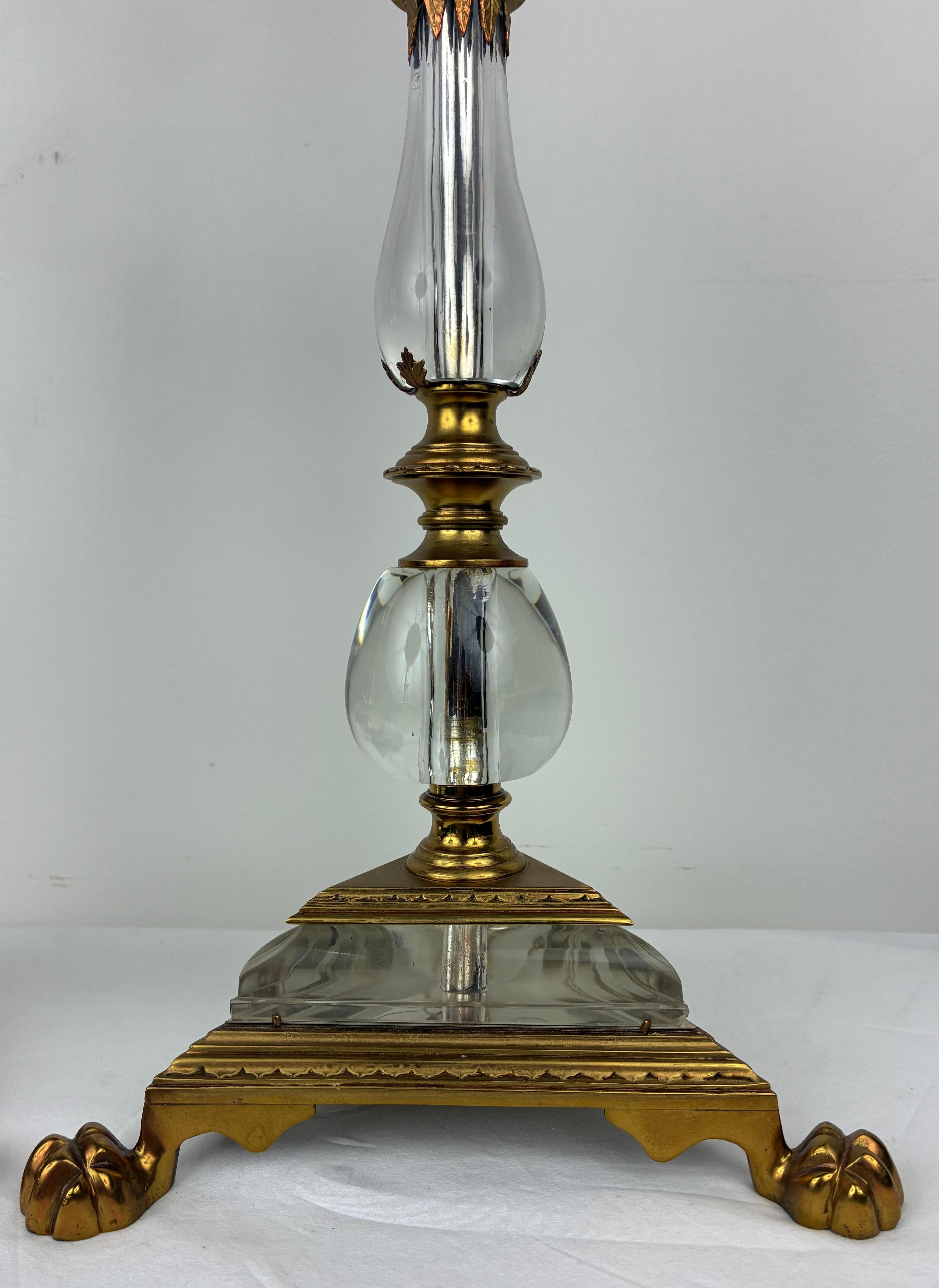 This handsome pair of crystal and gilt bronze lamps are attributed to the renowned firm of Edward F. Caldwell.