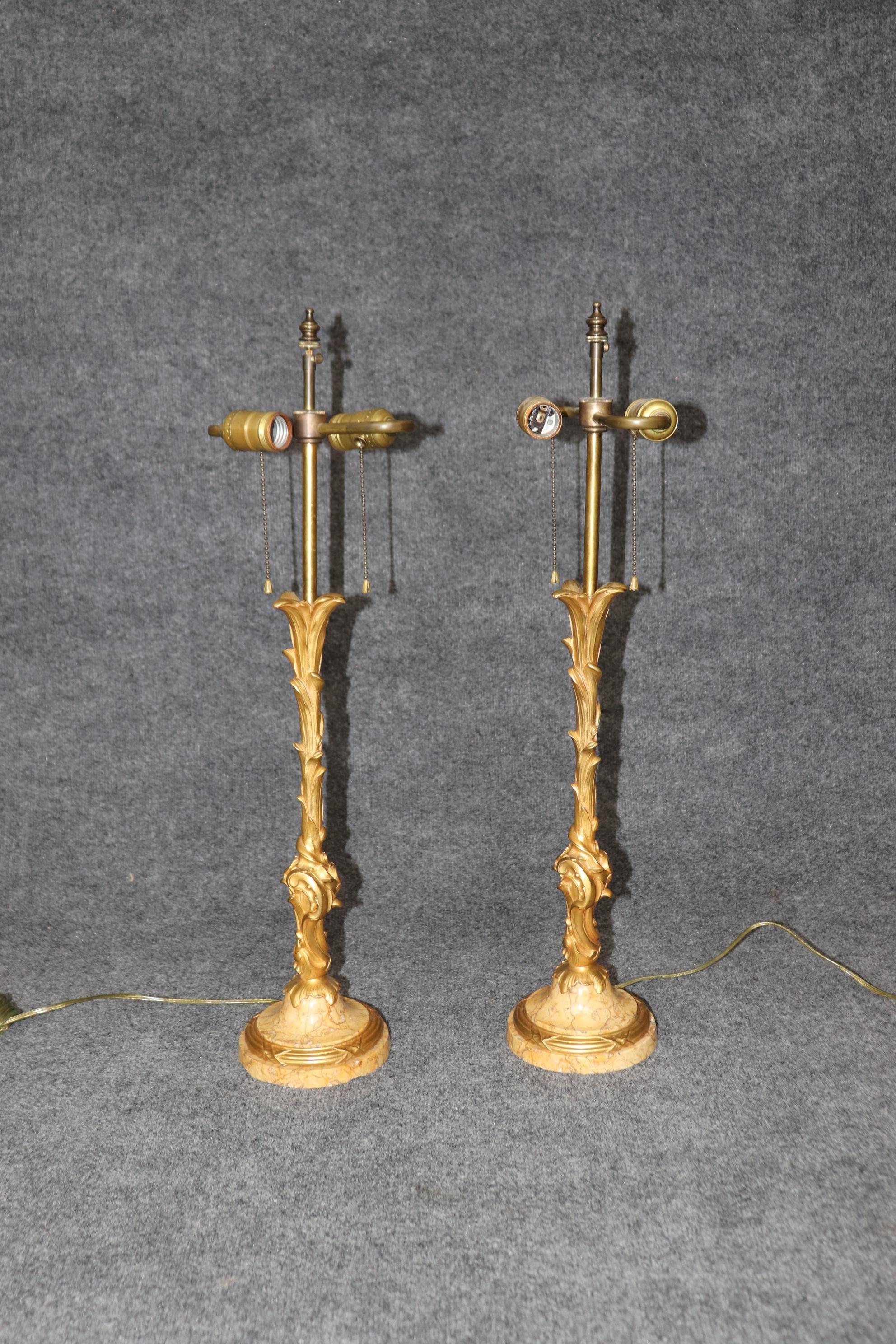 This is a superb, hand-crafted Maison Jansen attributed pair of Belle Epoque style Breche marble and bronze tree form table lamps. The lamps are gilded in dore' gold gilding over solid bronze and superb marble base in yellow ochre. The lamps are in