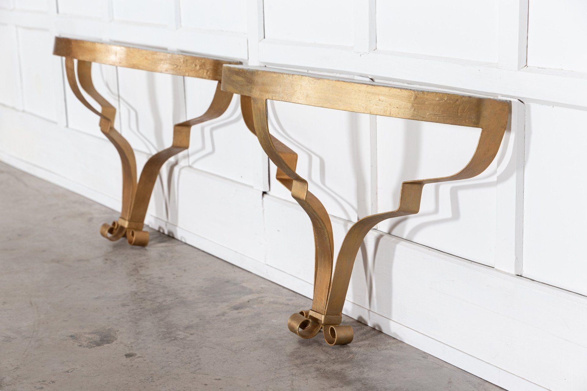 circa late 20thC
Pair of gilt metal console tables with simulated marble tops from a prominent film and theatre prop house.
Price per pair

W80 x D27 x H57 cm.