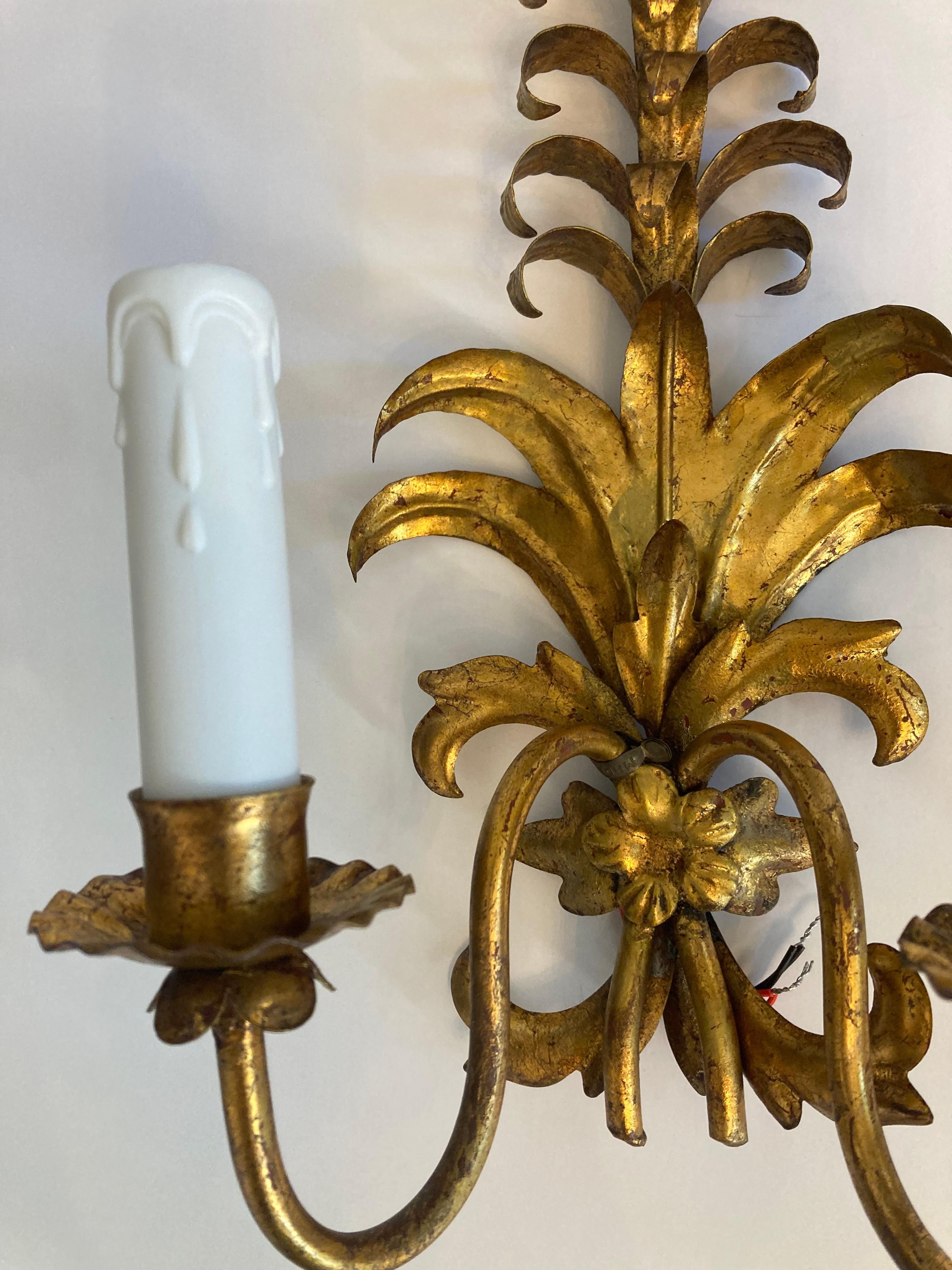 These stunning sconces are in gilt iron with 2 arms. American wired 
They can fit with modern or traditional interior home. 
the price of 2100 dollars is for the pair.
