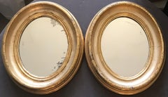 Pair of Gilt Oval Mirrors