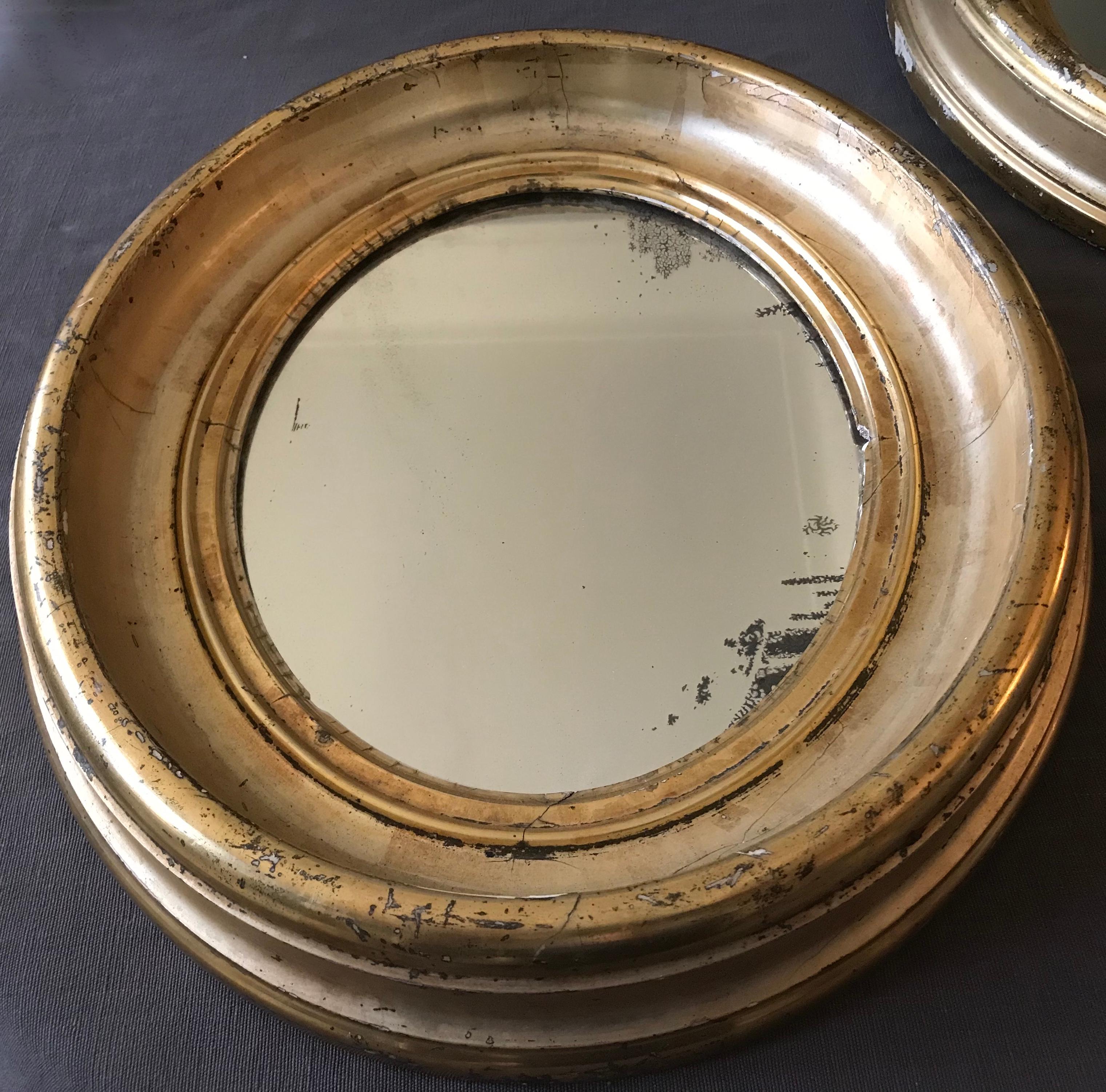 American Pair of Gilt Oval Mirrors