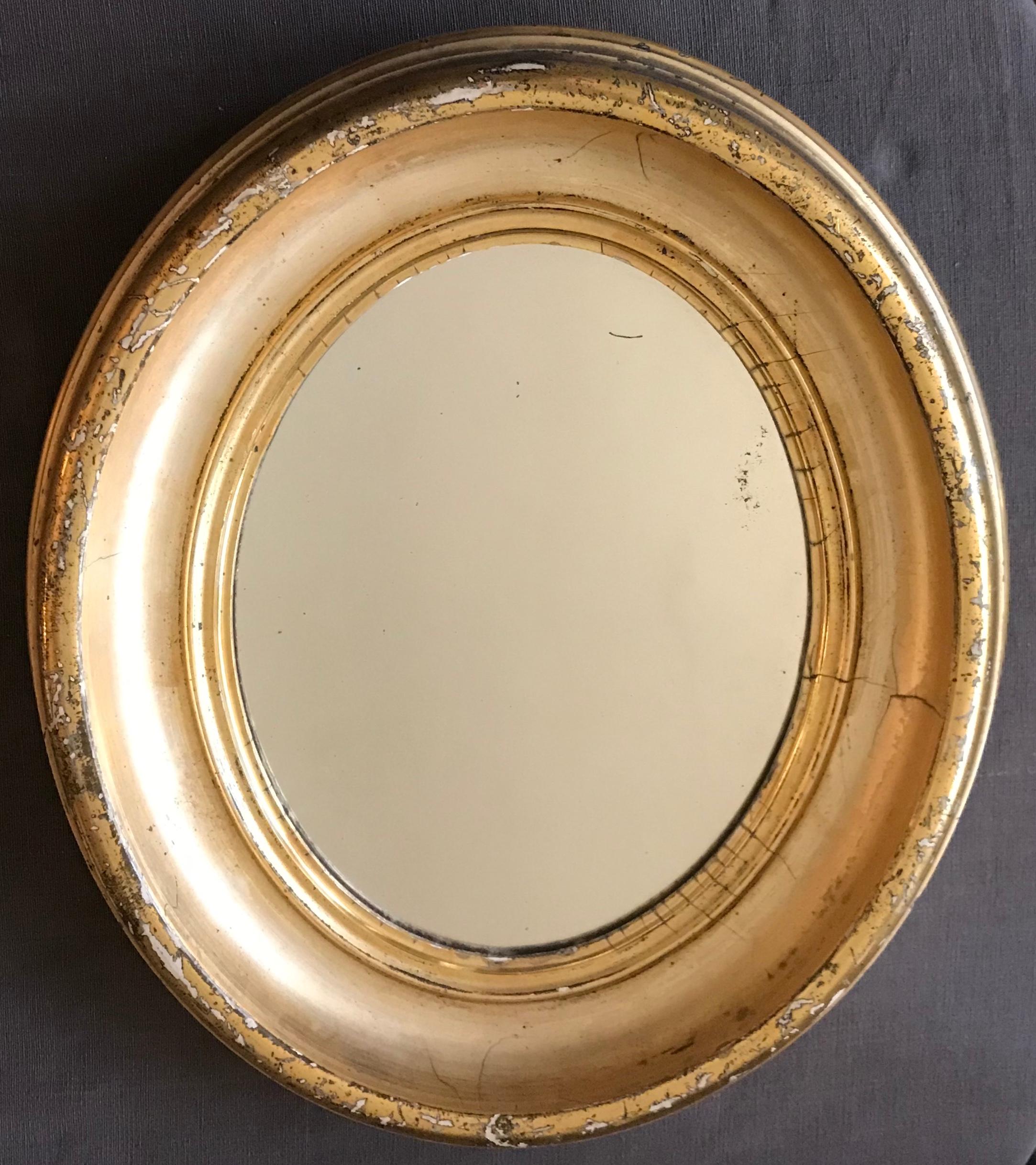 Pair of Gilt Oval Mirrors 1