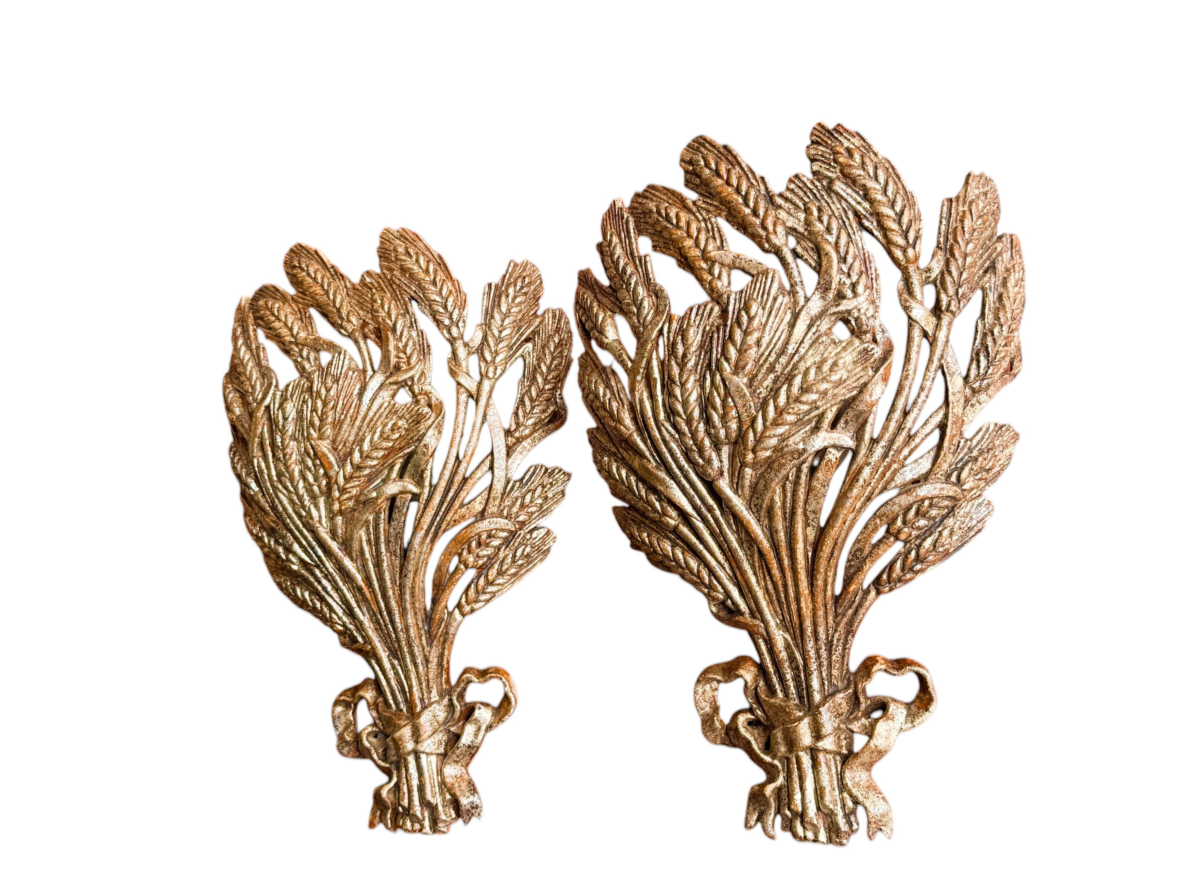 Add a touch of opulence to your home with this charming pair of sconces. Perfect gilded colored wheat sheaf to enhance any chic or eclectic home. We'd love to see it hanging in an entryway as a charming welcome home. Built in the 1980s or older,